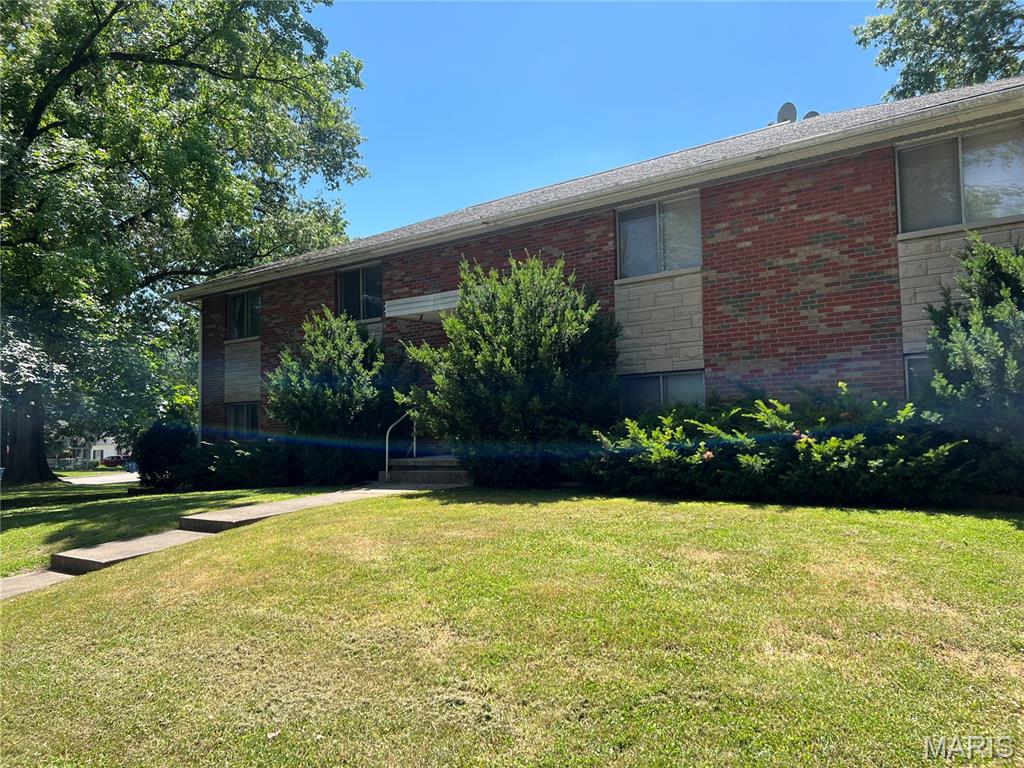 TWO-BEDROOM APARTMENT FOR RENT MERE BLOCKS FROM THE SIUE DENTAL SCHOOL! This spacious second-floor apartment features large rooms, fresh paint, new flooring, a patio, a covered off-street parking spot, keyed entry to building, and on-site laundry. This generous owner provides a stove, refrigerator, and lawn care. Sorry, no smoking or vaping and no pets whatsoever on the premises. MINIMUM QUALIFICATIONS: There is a $49 application fee for each adult applicant. This pays for a nationwide background and credit check. Our tenants must have been at their jobs for at least 6 months, bring in at least 3X the rent after taxes, possess credits scores of 600 or better, have NO EVICTIONS, bankruptcies, or foreclosure cases on their records, and have clean backgrounds.