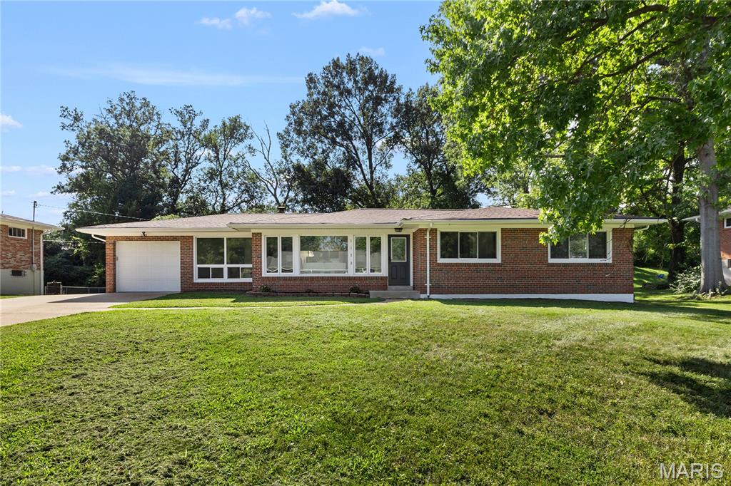 Welcome to 1133 Olivaire Lane, a beautifully renovated brick ranch in the sought-after Ladue School District! Step inside to discover a bright, inviting interior featuring gleaming hardwood floors, fresh neutral finishes, and an easy-flowing layout ideal for everyday living and entertaining. The stylish updated kitchen showcases white cabinetry, stone countertops, stainless steel appliances, modern lighting, and abundant workspace. A newly added sunroom, surrounded by windows and filled with natural light, provides the perfect setting for relaxing, dining, or enjoying views of the spacious backyard. Updated bathrooms offer contemporary finishes, while the finished lower level adds valuable flexible space for a recreation room, home office, gym, or media area. Additional highlights include an attached garage, a newer driveway, and a large, level backyard with plenty of room for outdoor enjoyment. Conveniently located near shopping, dining, parks, and major highways. Move-in ready and waiting for its next owner!