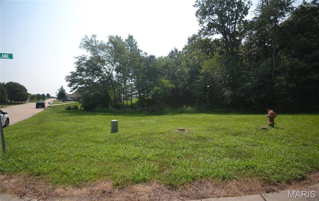 Discover the perfect place to build your dream home on this beautiful 0.37-acre corner lot in the desirable Seasons Ridge subdivision. This finished, surveyed homesite offers a level setting with mature trees and natural foliage, creating a peaceful backdrop while still providing plenty of usable space. Located in the Smithton School District, the property is ready for your custom build with a site plan already filed. Enjoy the charm of a well-established neighborhood with no HOA fees. Don't miss this opportunity to own a spacious homesite in a sought-after community!