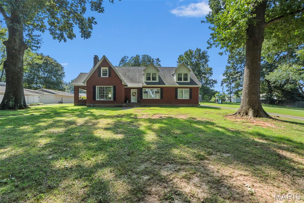 Charming, spacious, and full of personality, this 6 bedroom, 3 bathroom home has so much to offer! Set back from the street on a large lot, the home has fantastic curb appeal, a circular driveway with tons of parking, and an attached garage.

Inside, you'll find an impressive amount of living space, along with large bedrooms that offer plenty of flexibility for offices, playrooms, hobby spaces, or whatever fits your needs. Generous closets and storage throughout make this home as functional as it is charming.

One of the standout features is the true mother in law suite, connected to the main home by a breezeway with its own private entrance. It's an ideal setup for extended family, guests, or anyone looking for a little extra privacy while still being connected to the home.

Outside, the spacious yard provides plenty of room to play, entertain, garden, or simply enjoy the outdoors. And with a central location just steps from a park and convenient to everything you need, the setting is hard to beat.

With endless charm, incredible space, and a flexible floor plan, this home is just CUTE through and through!