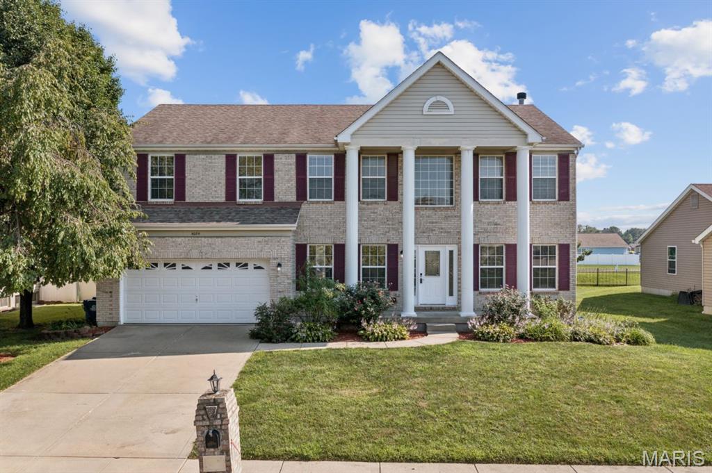 Exciting price improvement on this Swansea stunner, ready to welcome its next owner! This two story showplace delivers nearly 4200 finished square feet of pure functionality and style, anchored by soaring 9 ft ceilings and a flow that feels effortless from room to room. Durable Pergo flooring carries you through the main level living spaces, from the versatile living room/office and formal dining room to the family room and kitchen. Speaking of the kitchen, get ready to fall in love with the 42 inch cabinetry, full stainless steel appliance suite, oversized pantry, and a sunny eat in nook for everyday meals, with a freshly updated half bath tucked nearby for guests. Practicality meets convenience in the generously sized main floor laundry room, which pulls double duty as a mud room and drop zone with direct access to both the garage and backyard, because mornings should not have to be a battle. Curl up by the wood burning fireplace in the living room on chilly nights for that classic cozy feel. Upstairs, a smart split bedroom layout gives all four bedrooms their own walk in closet and ceiling fan, with the primary suite stealing the show through dramatic 9 ft vaulted ceilings, sophisticated double French doors, faux wood blinds, and a true spa retreat of a bathroom complete with double vanities, a soaking tub built for unwinding, and a massive 12x9 walk in closet. Head downstairs to the finished basement for even more room to spread out, with a rec room, bonus space, storage, and a full bathroom ready for guests or game night. Year round comfort is locked in with an all Lennox dual zoned HVAC system, and outside you will find a brand new Trex deck overlooking a private, professionally landscaped backyard, perfect for weekend cookouts. The location is nearly impossible to beat, with Golden Oak Pancake House and The Sweet Creamery for your breakfast and dessert fix, Fletcher's Kitchen & Tap for dinner out, boutique finds at Peace By Piece Co., St Clair Square mall just minutes away, and an easy commute into downtown St. Louis. With this price improvement, this lovingly maintained home is more attainable than ever, so grab your showing slot before someone else claims this one!