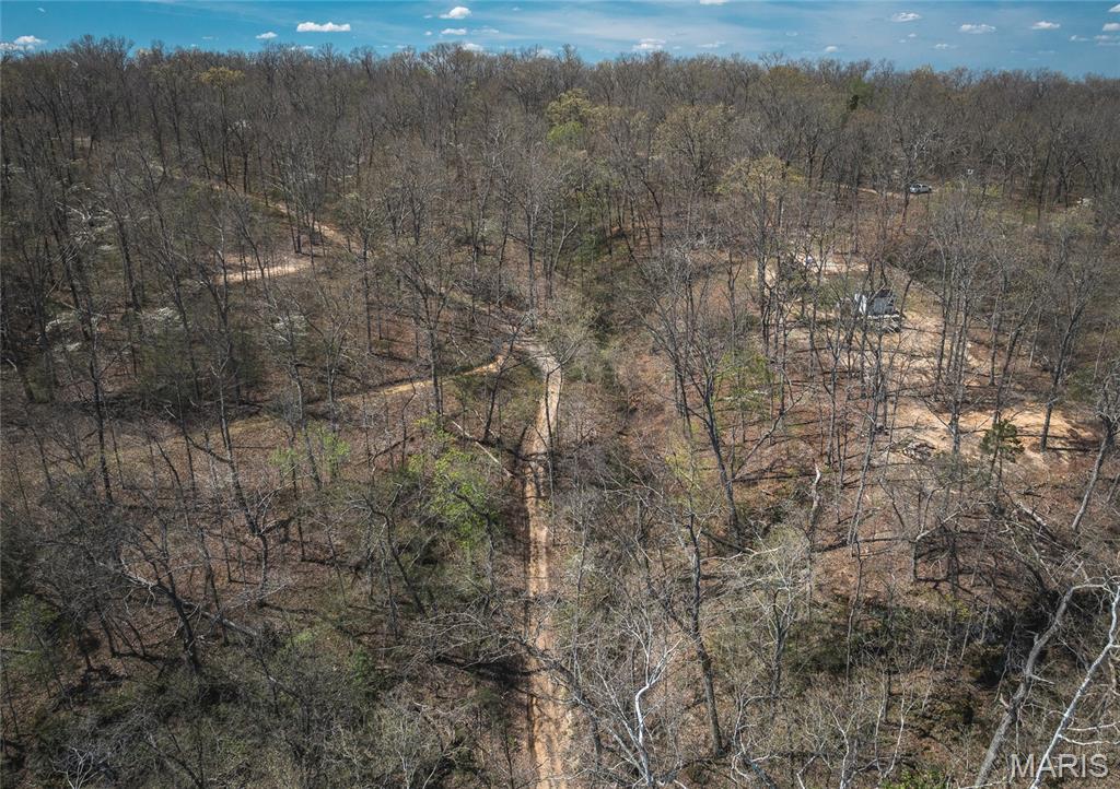 Escape to your own private slice of the Ozarks with this beautiful 17-acre property offering deeded access to three shared access points on the Upper Meramec River. Whether you're looking for a weekend getaway, hunting retreat, or a place to reconnect with nature, this property checks all the boxes. The land features a scenic mix of mature timber, gently rolling terrain, perfect for exploring, riding ATVs, or setting up the ideal campsite. Abundant wildlife makes this a great spot for hunting, while the nearby river access provides endless opportunities for floating, fishing, and relaxing by the water. Tucked away yet still accessible, this property offers the peace and privacy you’ve been searching for without sacrificing convenience. With multiple river access points just moments away, you’ll enjoy the best of both worlds—secluded acreage and easy access to one of the area’s most sought-after waterways. Whether you're dreaming of campfires under the stars, outdoor adventures, or a future build site, this property is ready for you to make it your own.