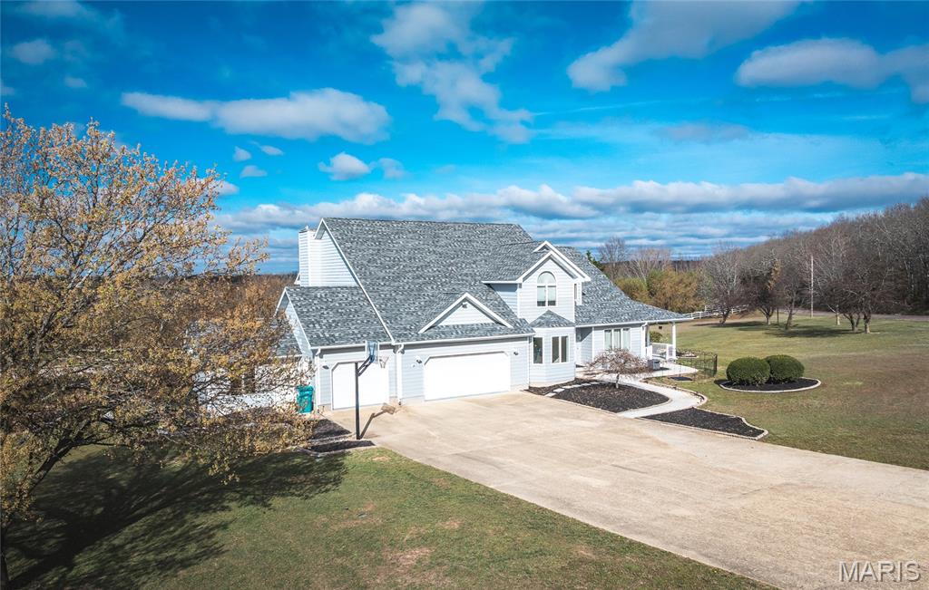 This stunning 5 bed + 4.5 bath home is a showstopper! The manicured grounds include a stocked pond with its own well, inground pool, hot tub, koi pond, & playhouse—perfect for outdoor entertaining! 
Inside, the two-story foyer leads to an architectural staircase, private office, & den.
The brand-new kitchen is a chef’s dream with soft-close cabinetry, a double wall oven, gas range, quartz countertops, and a center island. It connects seamlessly to the formal dining room, breakfast nook, and living room.
Upstairs, you'll find three spacious guest rooms, two updated baths, and a large master suite with tray ceilings, a massive walk-in closet, and a tastefully renovated bathroom, with a free standing tub!
The finished basement is perfect for entertaining, featuring a bar, sauna, a non conforming bedroom, full bathroom, & workout space/pool room, walking out to the backyard oasis, overlooking the stunning countryside! 
Call today to tour this one-of-a-kind property! 
*NEW ROOF 2024* Additional Rooms: Sun Room