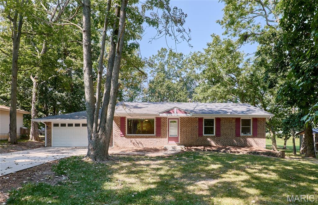 Look no further than this spacious and updated ranch home in a great Cottleville location! Situated on a half-acre lot on a quiet, tree-lined cul-de-sac, this home backs to Francis Howell Central HS. A brick front adds curb appeal and welcomes you inside to the bright, open layout of the main living space. You’ll love the hardwood floors and crown molding, plus wainscoting, 42” cabinets, and a breakfast bar separating the kitchen from the dining area. Beyond is the family room, featuring an electric fireplace with wood and granite detail. The primary bedroom has an en-suite half bathroom. Two more bedrooms and a hall bath with step-in tile-surround shower complete the main level. The finished basement adds a family room, 4th bedroom, laundry, and full bathroom with a large granite vanity and tile-surround tub. You’ll have a fully drywalled 2-car garage with its own entrance to the backyard. Enjoy grilling with friends and family on the deck and patio overlooking the fenced backyard, shaded by trees.

Conveniently located moments from all of the restaurants and shops on Mid Rivers Mall and in charming Old Town Cottleville, with quick access to highways and extensive walking and bike paths along the Dardenne Greenway, this home is one you won’t want to miss!