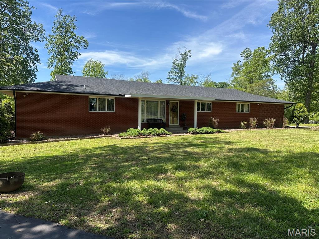 Custom built Rambling ranch, all brick.  4 Bed, 4 bath, 2 ensuites.  Large sunroom, circle drive, beautiful setting.  Gas heat an option.  Seller connecting house to public sewer.  Exact legal coming soon.