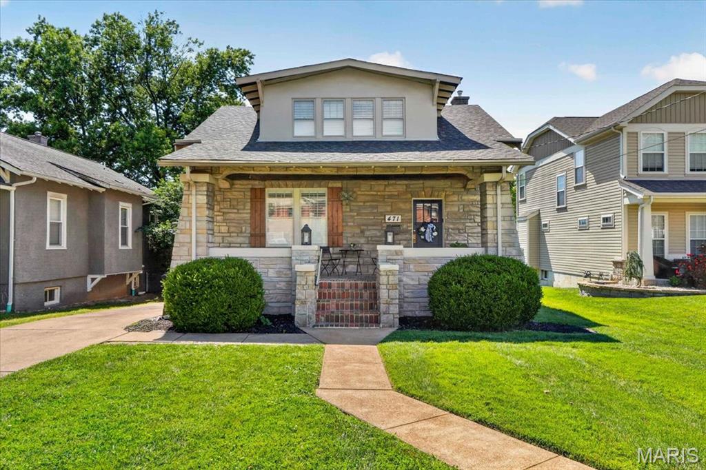 Charming, completely updated Craftsman-style 2-story home in the heart of Kirkwood, conveniently located within walking distance of downtown Kirkwood's shops, restaurants, parks, and entertainment. Brimming with character and timeless appeal, this home is situated on a beautiful level fenced lot featuring a welcoming covered front porch, spacious back deck, and patio for outdoor enjoyment. Step inside to find handsome wood floors throughout the main level, 9-foot ceilings, and an abundance of natural light. The inviting family room showcases a custom stone and brick electric fireplace and flows seamlessly into the dining room, creating an ideal space for everyday living and entertaining. The beautifully updated eat-in kitchen features stainless steel appliances, granite countertops, tile backsplash, and direct access to the covered deck. Upstairs features the primary bedroom with two walk-in closets, two additional bedrooms, and a stunning, updated full bath complete with a glass-enclosed walk-in shower and a built-in bench. The unfinished walk-out lower level features 9-foot ceilings and provides excellent storage or future finishing potential. A rare opportunity to own a beautifully updated Craftsman home in one of Kirkwood's most desirable and walkable locations. Move right in and enjoy the perfect blend of historic charm and modern updates.