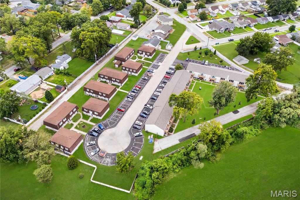Your opportunity to acquire a turnkey 64-unit income-producing multi-family portfolio in Granite City, Illinois.

This property offers a diverse mix of 64 residential units, including:
- One-bedroom / one-bathroom apartments – 24 Units (770 sq ft each unit)
- Two-bedroom / one-bathroom apartments – 24 Units (900 sq ft each unit)
- Two-bedroom / 1.5-bathroom townhomes – 16 Units (1050 sq ft each unit)
- One single-family home – 1200 sq ft

Property Highlights
- Unit Mix Variety: Appeals to a wide tenant base.
- Fully leased, delivering investors immediate income.
- Parking & Access: Assigned parking for tenants plus additional visitor spaces ensure ease of use for residents and guests. 
-Onsite Laundry - 3 convenient coin-operated laundry facilities.
- Security & Privacy: The community is fully enclosed with a privacy fence and secured through a gated main entry with a guard shack, providing peace of mind for residents.
- Community Features: Multiple courtyard spaces / 2 blocks from Wilson Park, a 74-acre city park that has been in operation since 1921, serving as a cornerstone for community activities.

Offering includes parcel numbers - 22-2-20-07-19-402-014 - Buildings 1&2 , 22-2-20-18-07-201-012 -2681 Center St., 22-2-20-18-07-201-009 - 2702 Center St. (Single Family), 22-2-20-07-19-402-013 - 2706-2734 Center St - WILL NOT DIVIDE