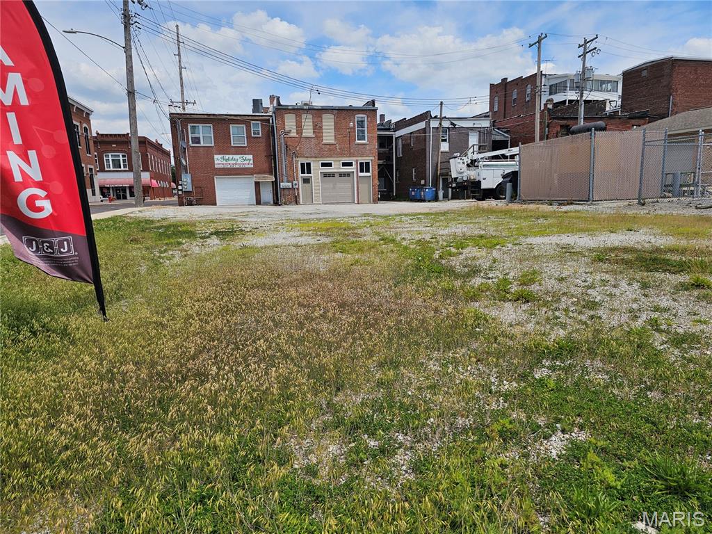 Excellent commercial opportunity in Hillsboro, IL.! Position your business for success with this highly visible corner lot zoned B1 in the heart of Hillsboro. Situated on the corner of Hamilton St./Route 127 and W. Water St. this property has excellent drive by exposure with over 4,000 cars a day. It is a level lot that is finished with gravel. It has curbs, gutters, sidewalks, streetlights, an alley behind and also utilities nearby. Whether you are looking for a spot to build a compact retail/office space or to secure extra parking for an existing local operation this is a unique opportunity to own a piece of thriving downtown Hillsboro!