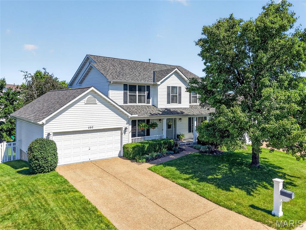 Prepare to be Wowed!  This beautifully maintained home sits on a level, fenced yard, has been updated and will check the boxes on your search for a home.  The curb appeal is impressive with a large front porch, enclosed fascia/soffits, exposed aggregate driveway, coach lights, architectural shingles and lush landscaping.  The garage has a 9x10 bump out in the rear making one side 29’7” deep.  Features include elegant wood flooring throughout the main floor, granite countertops, island with seating bar, tile backsplash, stainless steel appliances, gas range, roll out shelving, desk/workstation, pantry, Breakfast Room with bay window, Great Room with gas fireplace, large bay window, main floor Office/Flex Room, Dining Room, popular T staircase design and main floor Laundry.  The upstairs offers an open Loft area, double door entry to the Primary Bedroom and Primary Bathroom, spacious secondary bedrooms and a guest bath with palladium window for added natural light. The Primary Suite has double vanities, corner soaking tub, custom tile shower, water closet and a walk-in closet.  There is a humidifier, hi efficiency HVAC, and several of the windows and the breakfast room door have been replaced (Andersen Renewal) in the last 2 years.  The roof and gutters are newer (2 years old). The walkout basement has a rough in bath for an easy future finish if desired.  The backyard is an oasis with a deck with steps, patio at the walkout, added patio with a pergola, rock garden with firepit, mature trees, playset, and lots of open area for outdoor enjoyment.  There is a neighborhood pool, bathhouse, lake with water feature and walking trails.  There is easy access to Highways 79, I-70 and 370, Fantastic home, put this on your must-see list!