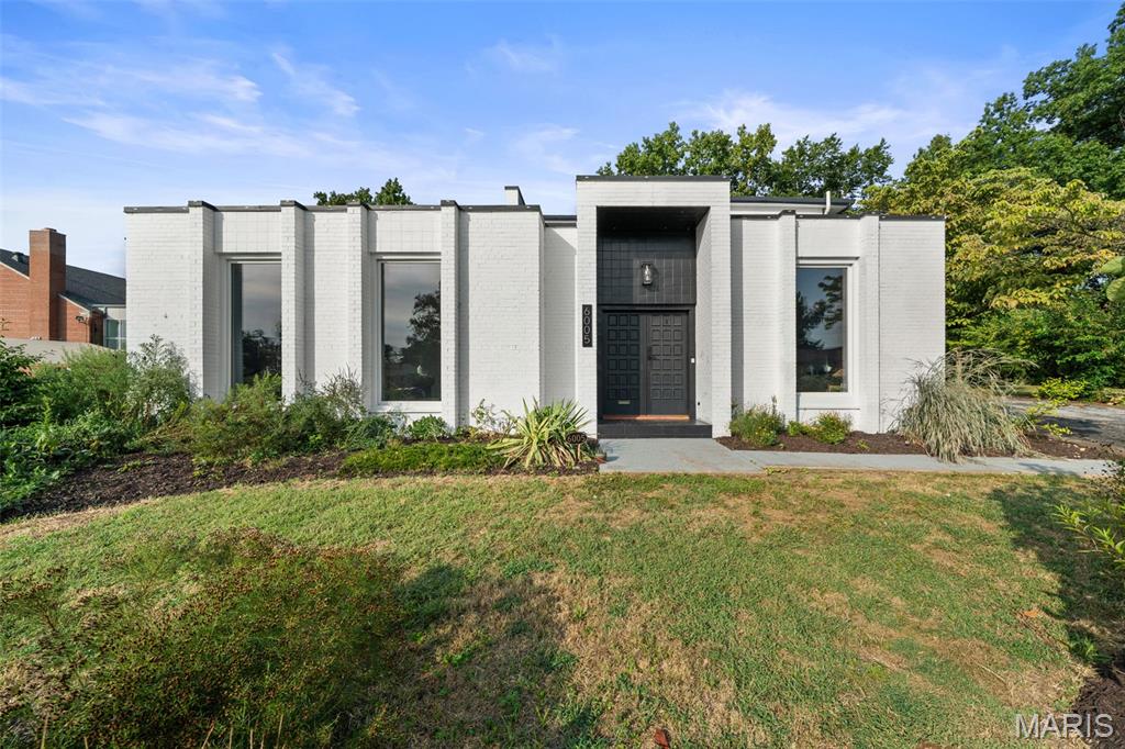 A rare opportunity to find this much space, style, and land in the heart of St. Louis City. Set on an extraordinary half-acre lot, this one-of-a-kind residence pairs more than 4,000 square feet of living space with modern updates, unexpected architectural character, and an incredible outdoor setting.

Originally built as a convent and thoughtfully transformed into a single-family home, the property offers a floor plan unlike anything else in the neighborhood. Expansive living spaces, generous room sizes, and flexible areas for entertaining, working from home, gathering, or simply spreading out create a sense of scale that is difficult to find within the city.

Inside, modern updates complement the home's distinctive history, creating a space that feels fresh, interesting, and entirely its own. Outside is where the property becomes truly exceptional. The remarkably large, level yard is surrounded by mature landscaping and lush gardens, offering privacy, room to entertain, space to play, and possibilities rarely available on a city lot.

For buyers who love the convenience and character of city living but don't want to sacrifice square footage or outdoor space, 6005 Bishops Place offers a combination that simply doesn't come along often: **modern living, more than 4,000 square feet, and over half an acre, all in St. Louis City.**