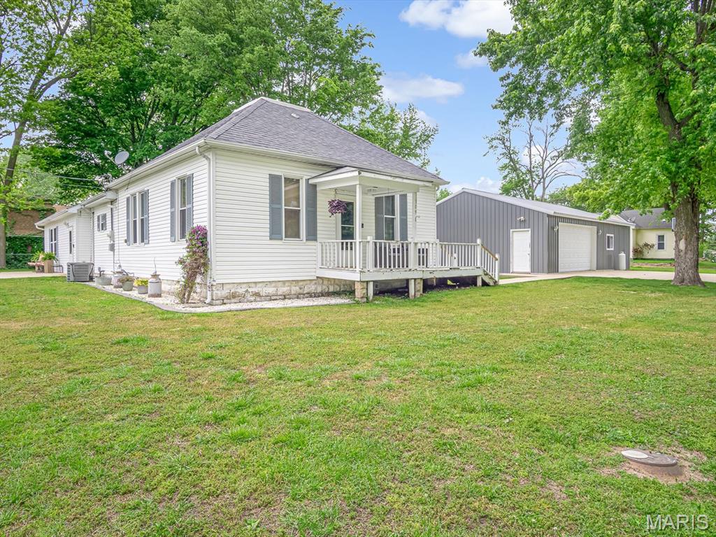 Situated on a corner lot across two separate parcels, this spacious home offers a versatile layout with room to spread out inside and out. Featuring 4 bedrooms and 2 bathrooms, the home includes two separate living areas—ideal for everyday living, entertaining, or flexible use of space. A dedicated dining room provides a defined area for gatherings and meals. In 2016, the previous garage was converted into additional living space, accompanied by major updates including a new roof and HVAC system—adding both comfort and long-term value. Outside, you’ll find a 30x40 detached two-car garage with an insulated garage door and insulated ceiling liner, along with ample parking—perfect for vehicles, hobbies, storage, or workshop use. With its combination of interior space, key updates, and a corner lot setting spanning two parcels, this property offers flexibility and opportunity for a variety of buyers.