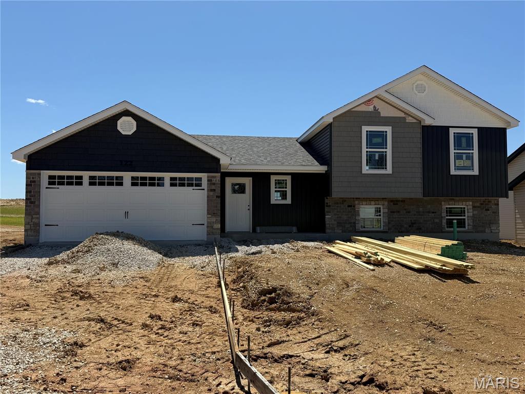 BRAND NEW home with every option you could imagine! They include vaulted ceilings, rounded “bullnose” corners, granite or quartz countertops, stainless steel appliances, 42" cabinets with "cushion close", custom neutral-colored paint job throughout, LVT flooring throughout most of the home, framed windows, taller baseboards, adult-sized cabinets in bathrooms with marble countertops, walk-in closets, upgraded carriage garage doors with openers on 2  CAR Garage, full bath rough-in, panel doors (many varieties), and upgraded water/light fixtures throughout the house! MAIN FLOOR laundry! Fully sodded yard (front/sides/back). *Pictures are of previously built homes. Builder/Broker* This home is USDA eligible.
