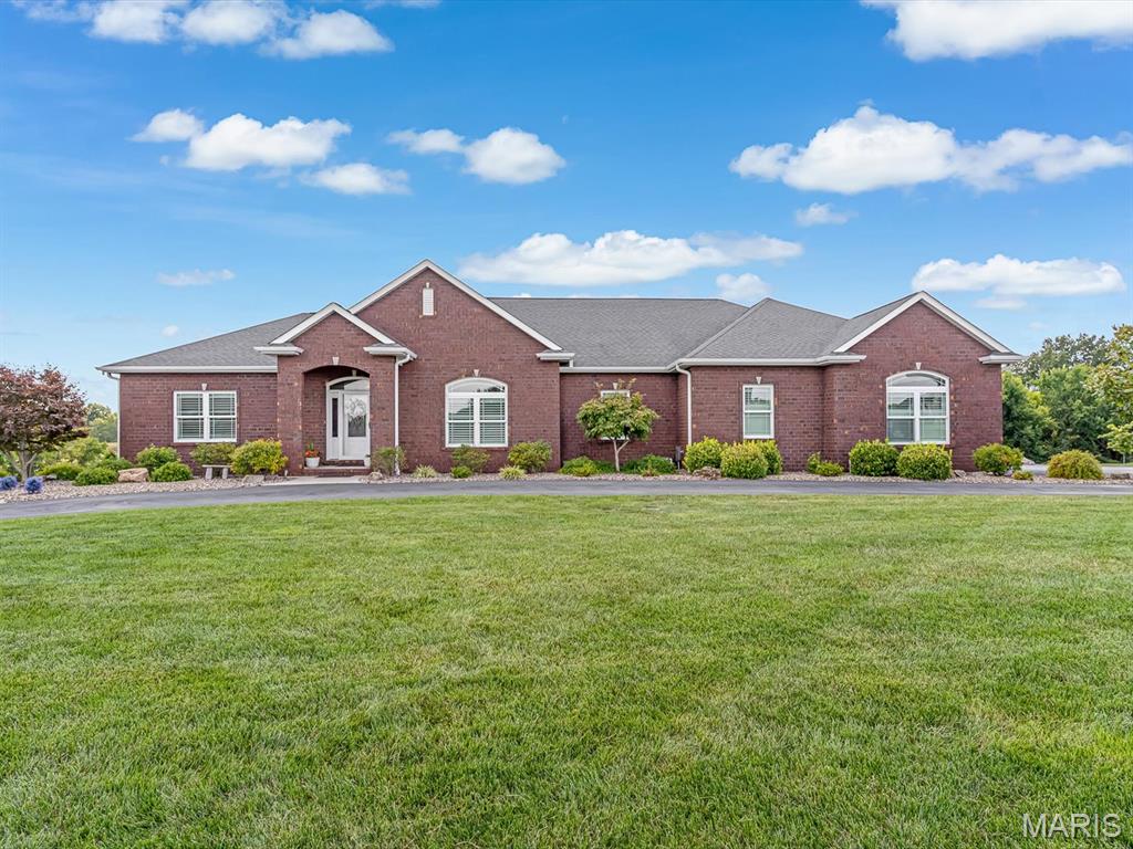 Welcome to 600 Covington Drive, located in the beautiful Remlok Subdivision in Waterloo! Built in 2017, this stunning 4-bedroom, 3.5-bath home offers approximately 4,100 square feet of finished living space, thoughtfully designed with modern style, comfort, and functionality in mind.
Step inside to a stunning modern open-concept living room, dining room, and kitchen, creating an impressive space for both everyday living and entertaining. The seamless layout feels spacious and inviting, complemented by crown molding in select areas, custom window blinds throughout the main level, with a newly installed gas fireplace.
The finished walkout lower level provides even more room to gather and entertain, complete with a full second kitchen and access to an additional walkout garage. The home also features a 3-car attached garage with a finished garage floor, offering exceptional parking, storage, and workspace.
Designed with efficiency in mind, the home features three-zone heating and cooling with three thermostats, a whole-house humidifier, high-efficiency gas furnace, recently replaced gas water heater,  water softener system, and sump pump. Step outside to your own backyard retreat, featuring a heated saltwater swimming pool, screened-in porch, and additional open porch-perfect for relaxing, entertaining, and enjoying summer days. A lawn irrigation system helps keep the grounds looking beautiful, while the blacktop circular driveway adds convenience and impressive curb appeal. With 4,100 finished square feet, two kitchens, multiple indoor and outdoor entertaining spaces, exceptional garage space, a finished walkout lower level, and a resort-style backyard, this beautiful Remlok Subdivision home offers an incredible combination of modern style, quality, comfort, and space.