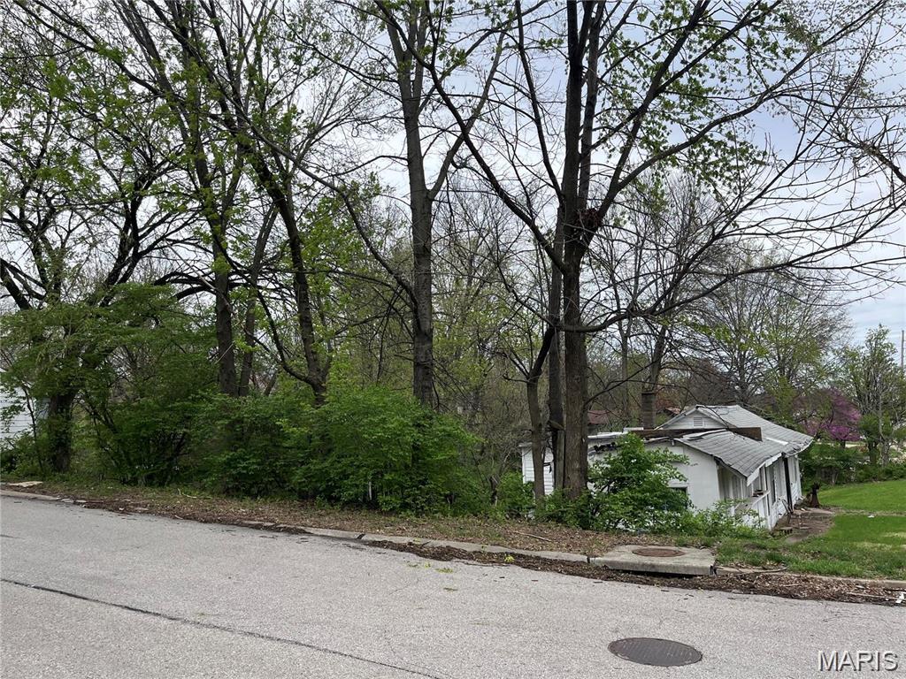 Incredible investment opportunity! This includes address at 10515 Clarendon. This package includes 3 residential lots totaling over 1/2 an acre. Utilities already established. The existing structures are unsafe and are considered tear-downs only.  Potential for re-zoning to commercial--Buyer to verify with county. Ideal for future development or investment. All dimensions to be verified by buyer.