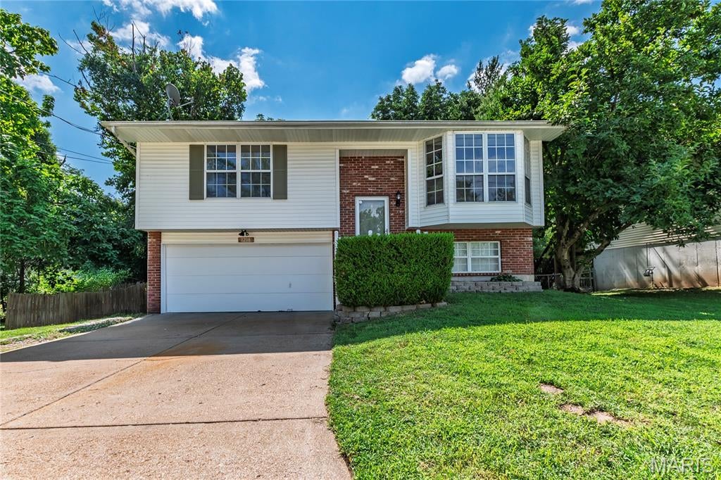 This inviting split level home offers the perfect combination of functionality, comfort and it is move in ready.  The main floor has an open floor plan with living room and kitchen having a vaulted ceiling, bay window in a living room that has a ship-lap accent wall and a large eat in kitchen.  Finished lower level with bonus family room and half bath.  2 car garage.  Step outside and enjoy the fenced in yard with plenty of space for entertaining.  New-Furnace 2025.  Conveniently located near shopping and major highways.  Seller has passing occupancy from Rock Community and the City of Arnold.  Seller is having new roof, gutters, some siding and some window screens replaced.