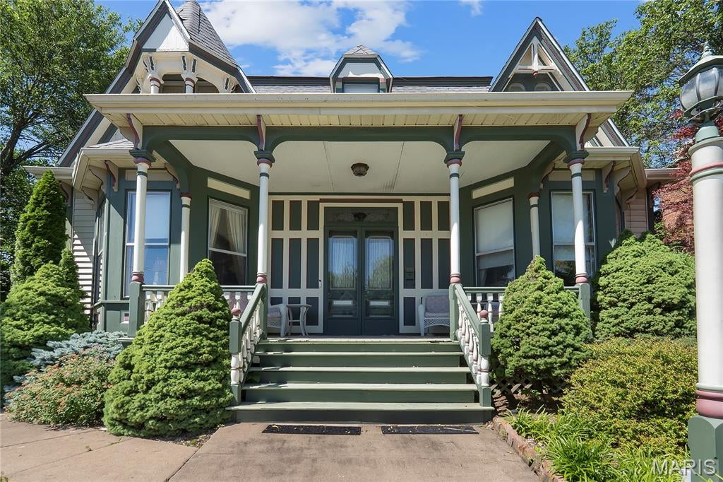Step into the past with this extraordinary historic Victorian home, perfectly situated within walking distance of the Mississippi River and the charm of an eclectic downtown, filled with unique shops, restaurants, and a rich history. This home is featured on the historic registry. Booming with character and architectural detail, this one-of-a-kind home is perfect as a rental investment or a cozy residence. It offers 5 spacious bedrooms and 6 bathrooms, boasting historic craftsmanship with comfortable living. Inside, you’ll find a formal dining room, a well-appointed kitchen, a convenient laundry on both levels, an elegant parlor for entertaining, and a warm, welcoming library perfect for quiet evenings or working on your latest project. The backyard and deck have a welcoming, relaxing garden feel but also plenty of private parking for guests. The detached garage has unlimited potential, with an upstairs full bath and bedroom area now. Throughout the home, detailed woodwork, soaring ceilings, reflect its Victorian heritage, while distinctive Old English and Scottish influences add a storybook ambiance. Every room captures the grace of a bygone era, creating a one-of-a-kind living experience. A place where old and new combine but ready to make it yours today!