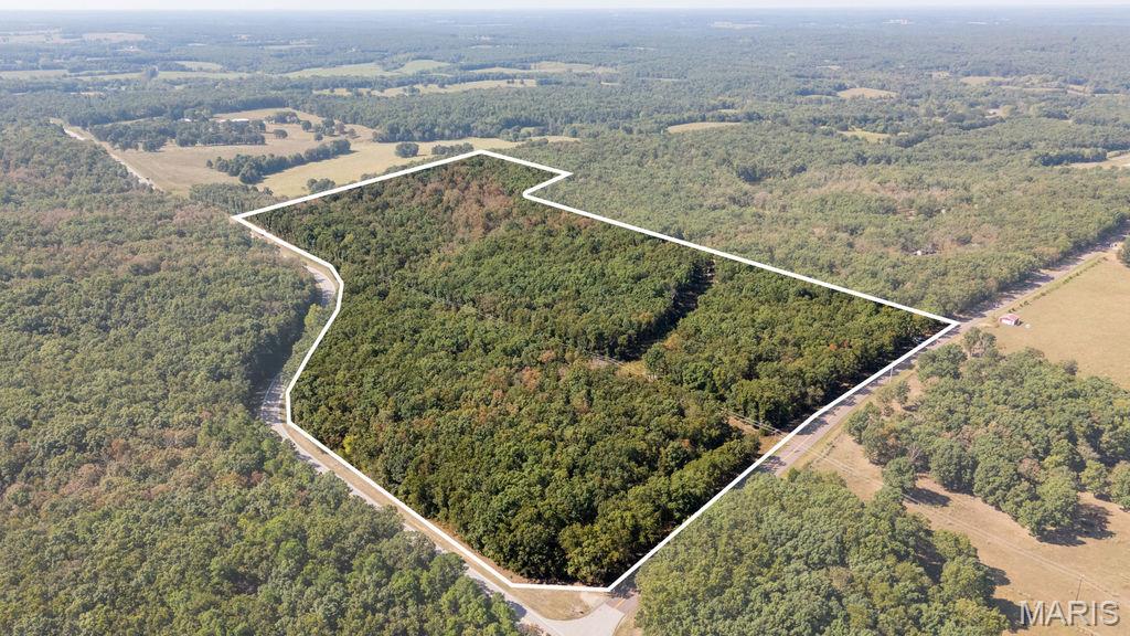 Tucked away in southern Phelps County between Salem and St. James, this 47± acre recreational property offers a unique combination of privacy, accessibility, and improvements that are ready to enjoy from day one. With frontage along both Highway 68 and Highway JJ, the property is conveniently located while still providing the secluded setting you've been looking for.
A gated entrance leads into the property and back to a private campsite designed to accommodate the whole family. The campground features four full camper hookups, each with level pads, 50-amp electric service, water, and sewer. A covered pavilion provides the perfect gathering place for cookouts, entertaining guests, or relaxing after a day spent exploring the property. This isn't your average campsite—the infrastructure has already been put in place to create a comfortable and functional recreational getaway.
Two additional outbuildings are equipped with power and offer plenty of storage as they sit, with the potential to be finished into additional cabin or guest space. The roads, camper sites, and campsite infrastructure are all less than five years old, allowing you to spend your time enjoying the property instead of starting from scratch.
Beyond the campsite, UTV trails wind throughout the 47± wooded acres, providing excellent access for riding, hunting, and exploring. The timber and terrain create quality wildlife habitat, with deer and turkey regularly captured on trail cameras. Whether you're looking for a place to hunt in the fall, ride UTVs on the weekends, or simply escape to the woods, there is plenty here to enjoy.

Location adds even more appeal. The property sits approximately 15 minutes from both St. James and Salem, while popular outdoor destinations such as Meramec Spring Park are only about 25 minutes away. This puts fishing, floating, hiking, and some of the area's best outdoor recreation within an easy drive. Properties that are this turnkey rarely become available. Call for your showing today!