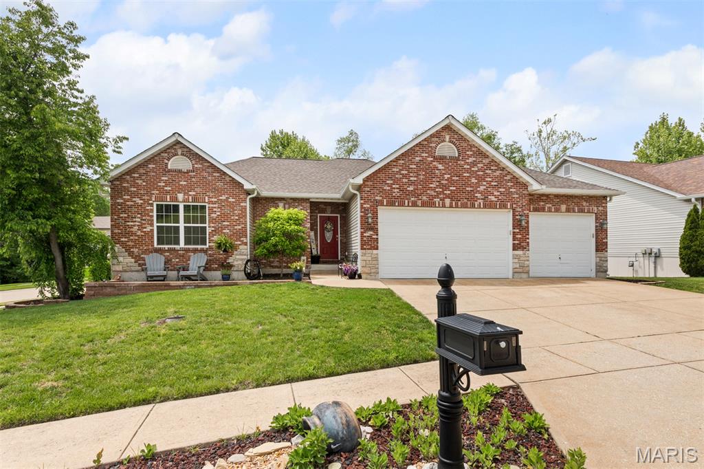 Welcome to this beautifully updated 4-bedroom, 3 full bath atrium ranch nestled in the heart of Arnold! This light-filled home features soaring vaulted ceilings, rich hardwood flooring, and an open floor plan designed for comfortable everyday living and effortless entertaining.

The stunning updated kitchen is a true centerpiece, offering quartz countertops, custom cabinetry with thoughtful features like a built-in pull-out spice rack, stainless steel appliances, and a spacious center island. The adjoining dining area flows seamlessly to the living room and out to the expansive composite deck, complete with a pergola and overlooking a private, tree-lined backyard.

The spacious primary suite features a beautifully renovated bath with double vanities, a luxurious Onyx walk-in shower, and a relaxing soaking tub. Two additional updated full baths provide stylish finishes throughout.

The finished walkout lower level expands your living space with a large family/rec room, a wet bar/kitchenette, and plenty of room for entertaining, hobbies, or guests.

Major updates include a NEW roof and HVAC (2021), giving buyers peace of mind. Conveniently located near parks, shopping, restaurants, and top-rated Fox C-6 schools, this move-in ready home offers the perfect combination of thoughtful updates, quality craftsmanship, and an exceptional setting.