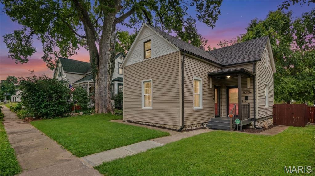 Welcome home to 318 N. Benton Avenue, a charming 3-bedroom, 2-bath, 1.5-story home that's full of character and ideally located in the heart of St. Charles.

This home offers the best of both worlds—classic architectural charm combined with stylish updates that make it comfortable for today's lifestyle. You’ll absolutely fall in love with this one straight from the curb! Inside, you'll find beautiful original woodwork, tall ceilings, crown molding, 10” baseboards, transom windows, and plenty of natural light that give the home a warm, inviting feel. Not to mention, a MAIN FLOOR LAUNDRY! The updated kitchen features white cabinetry, modern finishes, and plenty of cabinet and counter space, making it both functional and a great place to gather. Gorgeous LVP floors throughout the main level and luxurious ceramic tile throughout the upper floor!

The main level includes a spacious primary bedroom with ensuite, while upstairs you'll find two additional bedrooms, another full bath, and a flexible bonus space that's perfect for a home office, playroom, or reading nook. Another unique feature of this home is that a new buyer could opt to use the upper level as a complete primary suite if they so desired.  
Step outside to enjoy the fenced backyard with a private patio that's ready for relaxing, entertaining, or summer cookouts. There's also a huge, oversized, detached garage with extra storage and additional off-street parking, and boasting a 9’ overhead door!
HVAC and water heater were installed in 2019 and a new roof in 2023! Refrigerator, washer & dryer are included with the sale! Did I mention there's a main floor laundry?!
NOTE: The main level primary en suite was a separate rental unit with private entrance at one time, which is why it has it's own sink, stove and mini fridge. These can be removed and utilities capped if buyer prefers.

Location is where this home truly shines. Enjoy all that historic St. Charles has to offer with Historic Main Street just a 9-minute walk (or a quick 2-minute drive) away, where you'll find charming boutiques, award-winning restaurants, coffee shops, festivals, and riverfront entertainment. Outdoor enthusiasts will love being only a 3-minute bike ride from the Katy Trail, offering miles of scenic biking, walking, and running along one of Missouri's most treasured recreational trails. Close proximity to HWYs 70 & 370, Lindenwood University, Ameristar Casino, Streets of St Charles and so much more!
If you've been searching for a home filled with character, modern updates, and an unbeatable location, this historic St. Charles gem is THE one you won't want to miss!