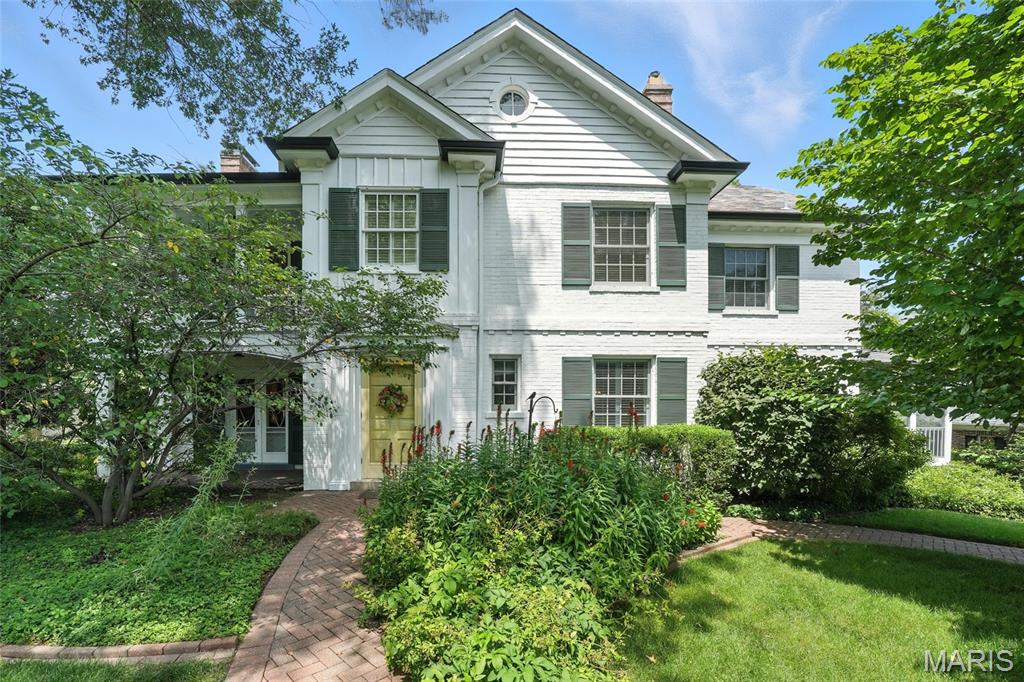 Nestled on a serene private street, this 1937 residence combines timeless character with modern sophistication. Situated on a large, wooded lot, the painted brick and board-and-batten exterior exudes curb appeal and classic elegance. Inside, rich oak hardwood floors flow throughout, complementing the inviting formal living room with its charming fireplace.
The cook’s kitchen is a culinary masterpiece, featuring custom maple cabinetry, granite countertops, a center island with gas cooktop, and premium Bosch, SubZero & Dacor appliances. A light-filled breakfast room and convenient main-floor laundry along with back staircase add to the thoughtful layout.
Designed for both relaxation and entertaining, the home boasts two expansive screened porches and a large family room addition with skylight, creating an effortless connection to the outdoors. The primary suite has it's own private balcony & dressing area, updated bathroom with tub and separate shower,  and is one of four well-appointed bedrooms, accompanied by an additional 2nd floor bathroom.
Additional amenities include central vacuum, a finished lower-level family room, lower level full bath & shower, additional laundry hook-up, a tuck-under garage with power for an electric vehicle, and irrigation system. In one of the area’s most coveted locations, this residence offers privacy, sophistication, and modern convenience in equal measure.