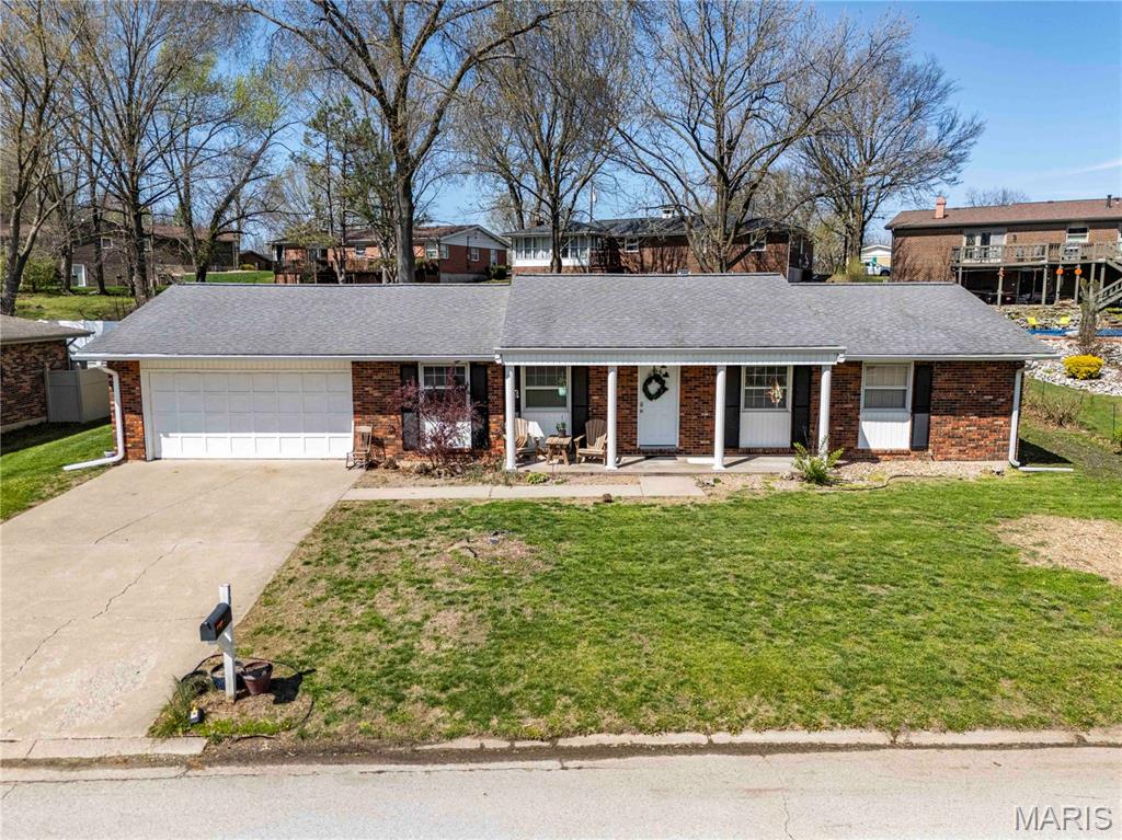 Welcome home to this well-maintained 3-bedroom, 2-bath ranch located in the desirable Lake Apollo Subdivision in Hannibal. Offering comfortable living spaces and a functional layout, this home is perfect for families, first-time buyers, or anyone looking for easy single-level living.
Step inside to a bright and inviting living room featuring large front windows that fill the space with natural light. The living area flows seamlessly into the dining room and kitchen, creating an open and welcoming atmosphere ideal for everyday living and entertaining. The kitchen offers ample workspace, a convenient breakfast bar for morning coffee or casual meals, and easy access to the attached garage, making unloading groceries a breeze.

The private bedroom wing features three comfortable bedrooms, including a spacious primary suite with an en-suite bathroom featuring a beautifully tiled walk-in shower.
Outside, you'll discover a backyard retreat with plenty of room to relax, entertain, garden, or customize to fit your lifestyle. The partially fenced yard provides both privacy and flexibility for pets, play, or outdoor enjoyment.