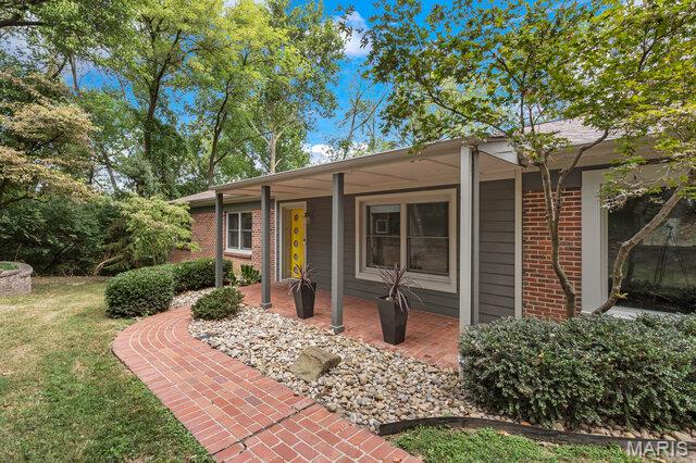 Welcome to 10 Ladue Frst! This four bedroom,three and a half bath ranch with a two car side entry garage is full of mid-century personality and sits on a private 1.1 acre setting in sought-after Ladue Forest. Trendy yellow door and inviting front porch begins the journey. Entry foyer opens to light filled living room and dining room with white oak wood floors.Family room with vaulted wood beamed ceiling, built-in book cases, and bricked fireplace creates a welcoming space. There are five skylights. You'll love the stylish cheerful kitchen with high-end appliances, quartz counters, pantry, an island, and an abundance of sophisticated cabinetry. Kitchen opens to a breakfast area. My favorite is the super fun four season sun room with a door leading to an outside patio.This one story home has three bedrooms on the main floor which includes; a primary bedroom with his/her closets and an exceptional primary bath. Two spacious bedrooms with wall to wall closets and a Jack-n-Jill bathroom.Hallway has half bath, laundry closet w/d stays and  linen closet.Walk-out lower level boasts carpeted recreational room with bar, an additional bedroom, full bath, a workout room, laundry room and storage closets. Step outside to professionally landscaped beds,walkways,two patios a fire pit, rod iron fencing. View upgrades list. Exceptional, meticulous move-in ready home on a cul-de-sac within top-rated schools. Low maintenance living and unbeatable location, this is the place to call home