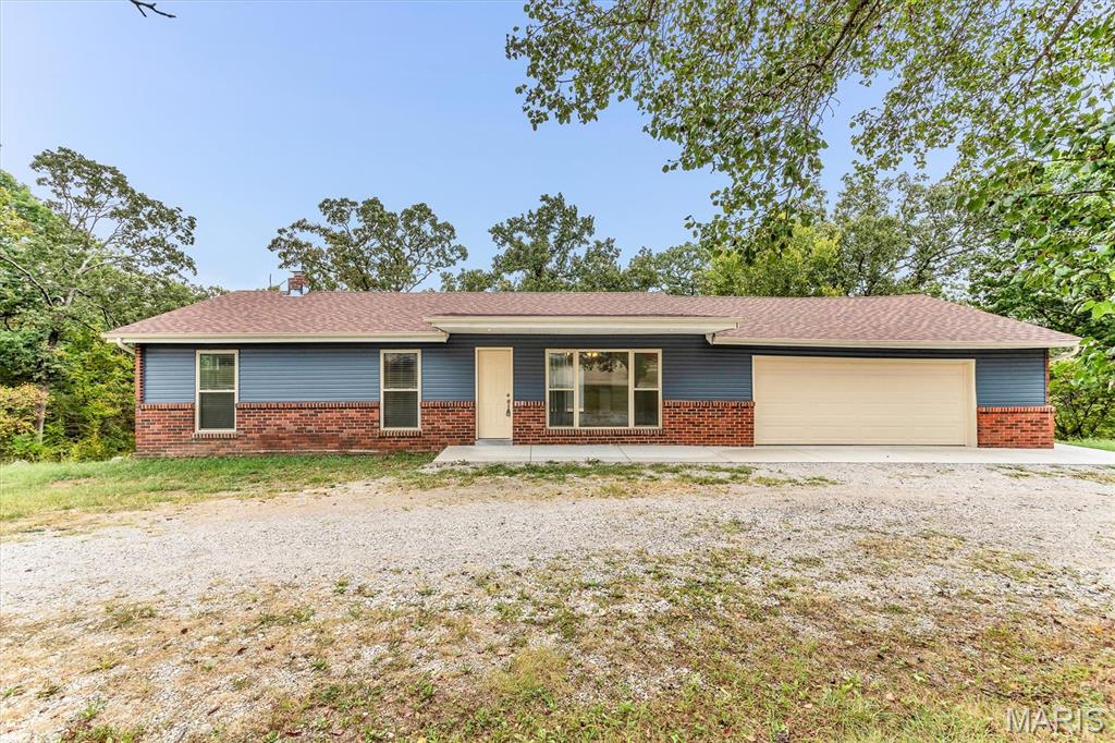 Updated Ranch home nestled in a country location, with easy highway access for your convenience. Almost 3 acres, wide usable lot, lots of additional parking, yet a private rear yard backing to trees
and lots of rooms for the kids and pets to play, adults too! Huge newer patio and newer deck for those summer B.B.Q's, or back porch sitting. Features an open floor plan with cathedral ceilings, opening to the updated kitchen with newer appliances, and walks out to the large newer deck. Also 3 Bedrooms and a bath on the mail level. The lower level walks out, has a half bathroom, updated 200amp electric panel, newer furnace , a/c, and water heater too.. There are ceiling fans thru out, 6 panel doors, light colors, so your buyer can come and make this home their own. Plus a low maintenance exterior, newer vinyl, soffit  fascia and windows too. So much to see. Motivated seller...
* * * *      SELLER MAY CONSIDER A 2% RATE BUY DOWN FOR THE BUYER !   * * * *