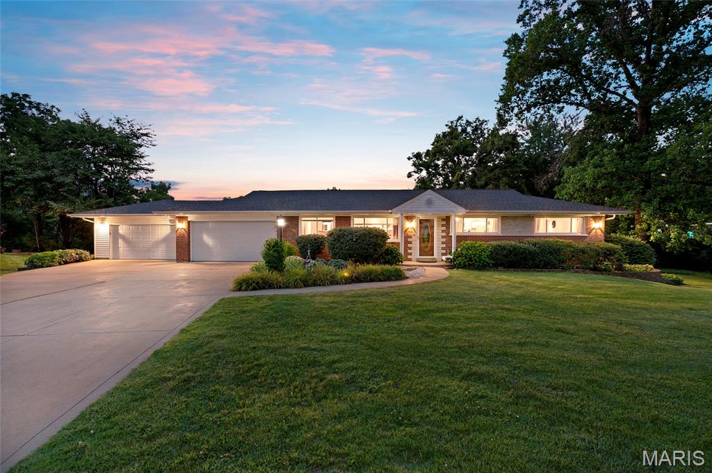 Looking for that Dream Garage in Sunset Hills? 2nd oversized 2-car garage (22x32) added, totaling 1,154 sq. ft of Garage space for cars, boats, and workspace! Also features an add'l poured foundation for a dedicated workshop, allowing plenty of room for projects & tools! This classic brick ranch nestled at the end of a quiet cul-de-sac, set on almost 1/2 acre (.47), features a level backyard backing to trees & a beautiful koi pond out front. Relax with your morning coffee watching the wildlife from the wonderful sunroom or deck!

Enjoy peace of mind with updates such as a new architectural-style roof (2026), A/C (2025), furnace (2019), beautiful kitchen granite countertops and peninsula bar & table, updated main bathroom, and luxury vinyl tile flooring in the living room & breakfast room. 
The walk-out lower level features extra living space ideal for a family rm., media center, or play area, a 4th bdrm, 3rd bathroom, and HUGE Walk-in Closet! All while still allowing for abundant storage space!

**M/F laundry is unvented, but seller is leaving the European-style ventless  W/D combo. Additional Laundry hook-up in LL for Electric or Gas Dryer **Home sq. ftg. & Lot size in incorrect in tax records **See Agent remarks for Offer information
