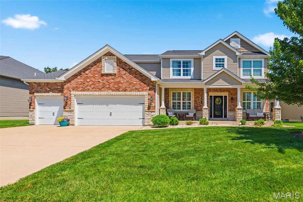 Welcome home to this spacious 5-bedroom, 3.5-bath two-story in the highly sought-after Wentzville School District (Liberty)! From the moment you step into the impressive two-story foyer, you'll appreciate the open and inviting floor plan designed for both everyday living and entertaining.
The soaring two-story great room features a cozy fireplace and a dramatic wall of windows that fills the space with natural light. The beautifully appointed kitchen offers stainless steel appliances, granite countertops, a center island breakfast bar, under-cabinet lighting, pull-out cabinet drawers, and a walk-in pantry. The adjoining breakfast room provides access to the level backyard through sliding glass doors, while the adjacent family room creates the perfect gathering space.
The main floor also includes a formal dining room and private home office, both accented with arched doorways and plantation shutters, along with a powder room and convenient mudroom just off the 3-car garage.
Upstairs, you'll find four generously sized bedrooms, a convenient laundry room, and a spacious primary suite featuring two walk-in closets and a luxurious en-suite bath with dual vanities, a soaking tub, and separate shower.
The finished lower level expands your living space with a large recreation room, granite-topped bar with beverage cooler, built-in media wall storage, a full bath, and a fifth bedroom with a walk-in closet. A versatile bonus room offers endless possibilities for hobbies, fitness, or storage and features a unique track system that stays with the home, plus a built-in hideaway underneath complete with power for lighting.
Outside, enjoy the lush level backyard, large covered front porch, and excellent location near Highways 40/64 and 364, with easy access to shopping, dining, parks, and everyday conveniences. This home is also equipped with a holiday light package. 
This home truly has room for everyone—schedule your private showing today and discover all the exceptional features it has to offer!