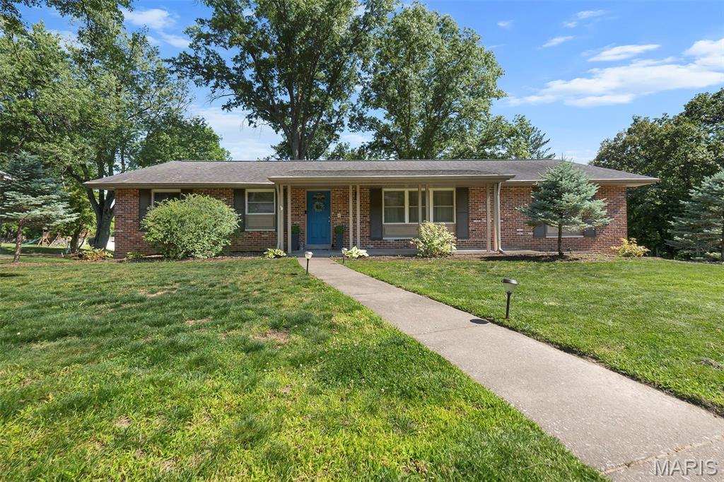 Beautifully maintained and full of charm, this ranch home offers comfort, functionality, and room to grow! The main level features 3 bedrooms plus a spacious laundry room with washer and dryer included that could easily transition back into a 4th bedroom if desired. The full hall bath showcases a tile surround shower and offers convenient access from one of the bedrooms as well. The spacious eat-in kitchen is both practical and inviting with gorgeous cabinetry and plenty of room to gather. Just off the kitchen, you’ll find a cozy den featuring a woodburning fireplace with a newly re-lined concrete flue, creating the perfect spot to relax. Tucked privately at the back of the home, the primary suite offers a full bath with a 5-foot shower and walk-in closet. Additional highlights include hardwood floors, a tankless gas water heater, 90% efficiency HVAC system, and a fully sheet rocked two-car tuck-under garage. The unfinished walkout basement is already well on its way to becoming additional living space with an extra bedroom framed out complete with egress, a full bath with toilet installed plus vanity and shower ready to finish, and room for a large additional living area. All of this situated on a corner lot in a subdivision offering lake and pool access for even more to enjoy year-round!