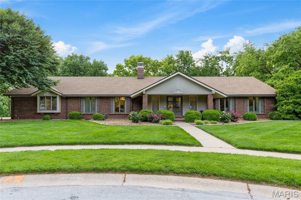This outstanding atrium ranch from award-winning Schaeffer Homes features an open floor plan designed to accommodate daily comfort & gracious entertaining. Impressive covered porch entrance with remarkable leaded glass double doors leads to tiled foyer, formal dining room with floor-to-ceiling windows and spectacular great room with beamed cathedral ceiling, diagonal oak flooring, brick fireplace & dramatic wall of windows that offer sweeping views of the surrounding countryside. Custom designed kitchen with quartz countertops, 42” white cabinetry, KitchenAid appliances & 7’ center island adjoins light-filled breakfast room with sliding glass door that opens to deck. Primary bedroom suite with sitting area & updated bath with freestanding tub provides a relaxing retreat.  A secondary bedroom, hall full bath & convenient laundry complete the main floor living quarters. Broad atrium staircase accesses Lower Level entertainment space with recreation room with fireplace, built-in bookcases & wet bar and game room plus work room, 3rd & 4th bedrooms & 2 full baths. Situated on a wooded 2.7-acre lot at the end of the cul-de-sac lot with continuous vista views features resort style infinity pool, composite deck, covered patio with stone bar & open patio with full-height fireplace.