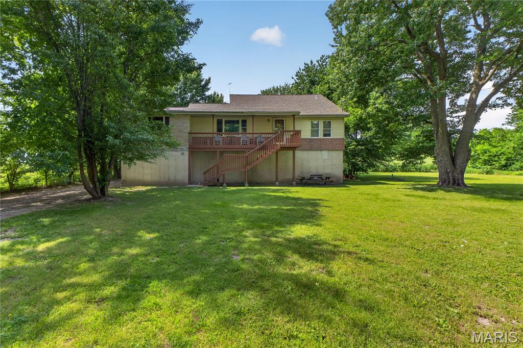 Discover the possibilities with this spacious 4-bedroom home situated on a generous 1.22-acre lot in the heart of Winfield. Offering over 2,100 square feet of living space, this property provides the perfect blend of small-town charm and room to grow. Inside, you'll find expansive living areas, generously sized bedrooms, and plenty of space to make your own. Outside, the mature trees and large yard create a peaceful setting with endless opportunities for gardening, outdoor entertaining, recreation, or future enhancements. Conveniently located near schools, shopping, dining, and major commuter routes, this property offers exceptional potential for handy homeowners or anyone seeking extra space both inside and out. A rare opportunity to enjoy acreage within town limits while adding your personal touch and building equity. Selling as-is, New Roof 2023.