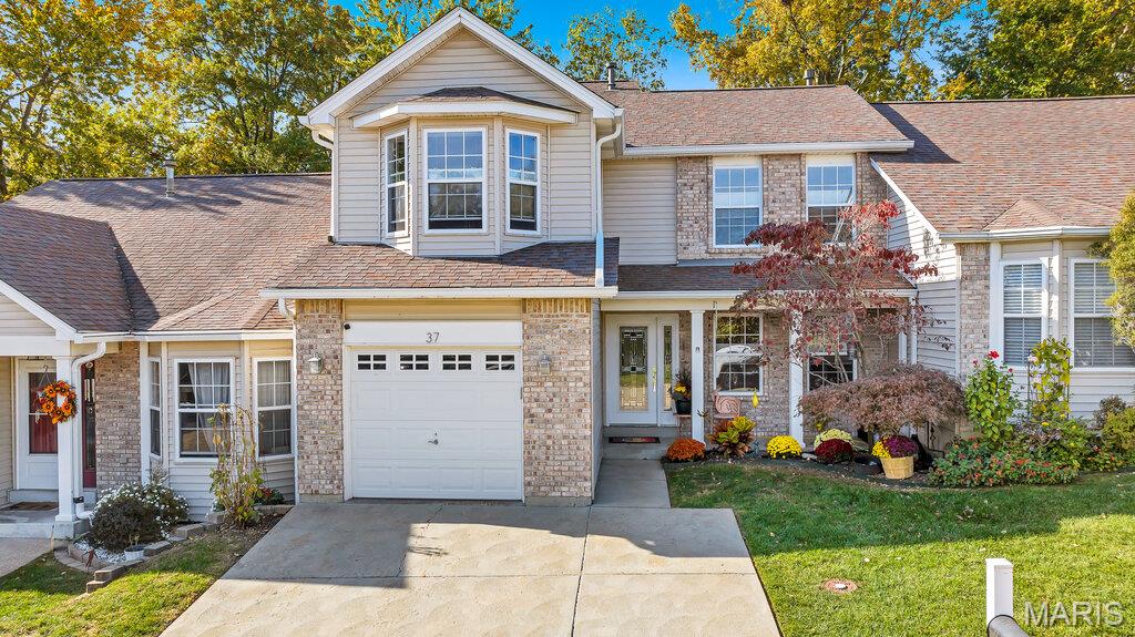Welcome to 37 Parkway Villas Court, a meticulously maintained 3 bedroom, 3.5 bath villa in the Francis Howell school district in the City of St. Peters. This home offers an exceptional blend of comfort, style, and low maintenance living. Every detail of this thoughtfully updated home reflects quality craftsmanship and pride of ownership. Step through the stunning leaded glass entry door into the sitting room featuring a marble fireplace, custom millwork, and track lighting perfectly suited for showcasing artwork. The beautifully updated kitchen is a standout with LG Studio appliances, soapstone countertops, custom floating shelves, built-in pantry storage, and pull out shelving throughout many cabinets. The bright and spacious two story family room creates the perfect setting for relaxing or entertaining, highlighted by a marble fireplace, large windows and chandelier with a remote lowering feature for easy maintenance. Rich white oak hardwood flooring spans the main level, while Brazilian pecan solid hardwood flooring spans the second floor. The spacious bedrooms offer abundant natural light and generous closet space, while the convenience of main floor laundry adds to the ease of everyday living. The finished lower level provides incredible flexibility with a recreation room or possible third bedroom and brand new full bath. Outdoor living is equally impressive with a solid tigerwood deck, limestone patio, and French drain system creating a private retreat for morning coffee or evening gatherings. Additional updates include upgraded six inch gutters, remodeled staircase with metal balusters, custom solid wood doors with reed glass inserts, Emtek hardware and glass handles, smart garage door opener, newer heating and cooling system, steam humidifier, and air scrubber. Thoughtfully designed and meticulously updated, this villa offers a lifestyle of comfort, convenience, and style.