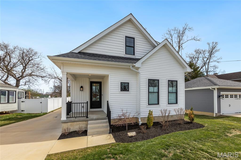 Stunning 3 yr-old custom built, 1.5 story home located in the Woodbine Heights neighborhood – Top Rated Kirkwood School District. This home features 4 bedrooms - 3 full baths & 1 half bath, with over 3300 sqft of living space, including the deep pour, professionally finished lower level. From the moment you drive up to the house, and walk through the 8ft custom front door, you will know you are home. This home shows like a display home and is truly move-in ready. It boasts an extremely functional, and open floor plan, designed for today’s living and entertaining, featuring a gorgeous, chef’s dream, eat-in kitchen with an abundance of custom cabinetry, top tier Quartz countertops & full height backsplash, large contrasting color center island (with storage) / breakfast bar, pantry, and top of the line Thermador appliances, including range, fridge, hood & dishwasher, WOW, opening to the breakfast room and hearth room with accent wall with heat & glo fireplace with granite surround, French doors leading to the patio, and an incredible picture window, bringing the outside in. If that is not enough, there is a beautiful master retreat, complete with trey ceiling, huge custom organized walk-in closet, and a luxurious master bath with large double vanity & custom tiled walk-in shower, a lovely powder room, and main floor laundry / utility room, currently used as a home office, too, complete the main floor. Walk up to the spectacular, handcrafted staircase with iron balusters to the second floor and you will find a cozy loft, and 2 additional nice sized bedrooms, sharing a Jack & Jill bath. The deep pour professionally finished lower level is awesome with a fantastic rec room with 2 egress windows & Luxury Vinyl Plank flooring, the 4th legal bedroom, and 3rd full bath, still leaving plenty of unfinished storage space. Additional features include high-efficiency York dual zone HVAC, premium lighting throughout, premium plumbing package, engineered hardwood floors, security system, built-in speakers on main level, and an oversized, detached 2-car, just to name a few. Sip a cup of coffee or have a night cap on the covered front porch or relax on the rear concrete patio. This home is perfect for entertaining family and friends, and the location could not better, near major hospitals, shopping, restaurants, schools and county parks – easy access to major highways.