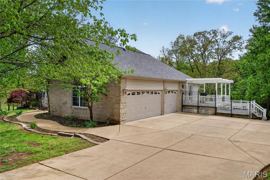 Welcome home to this exceptional five bedroom, four bathroom residence with a flat, level driveway leading to a spacious 3-car garage. Perfect for convenience and curb appeal. The heart of the home is the newly renovated kitchen is equipped with all new stainless steel Kitchen aid appliances including a refrigerator, double oven, microwave, dishwasher and gas cooktop. All complemented with new cabinets from Beck Allen, new granite countertops with new backsplash. All new flooring. The primary suite offers coffered ceiling, a generously sized walk-in closet, en-suite soaking tub and new shower along with new cabinets and granite countertops. 
Step inside this stunning atrium ranch, where natural light floods every corner, creating a warm and inviting atmosphere. The updates don’t stop there—every first-floor bathroom has been refreshed with modern vanities and finishes. Custom built-in display bookshelves add charm and functionality on both the main and lower levels. Need room to spread out? You’ll love the two distinct living areas—one on the main floor and one on the walkout lower level. 
Out back, your private oasis includes a sparkling pool overlooking a serene, sloping wooded lot—a picturesque retreat right at home. Downstairs, the lower level is an entertainer's paradise. It boasts a custom bar area, two additional bedrooms with beautiful backyard views, and two bathrooms (a full and a half). Whether it's hosting friends, accommodating family, or simply unwinding, this space has it all. This home is where thoughtful design and tasteful upgrades come together to create a truly delightful living experience. Ready to see it for yourself?