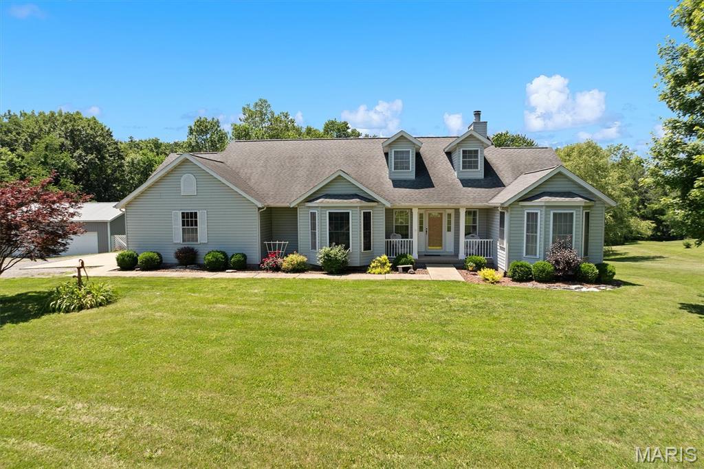 Escape to your own private retreat on 5 beautiful acres featuring a stocked pond, fruit and pecan trees, and peaceful country surroundings. This spacious 4-bedroom, 3-bath ranch with a walkout basement offers the perfect blend of comfort, functionality, and privacy. The heart of the home is the stunning oversized kitchen, showcasing new cabinetry, granite countertops, a large center island with a second sink, and abundant workspace for cooking, entertaining, and gathering. The home also features two fireplaces, creating warm and inviting living spaces on both levels. Step outside to enjoy the partially fenced yard, relax on the 10' x 28' deck overlooking the property, or take advantage of the impressive 30' x 40' outbuilding complete with concrete floors and electricity—ideal for hobbies, storage, equipment, or a workshop. Both public water and a well are available, providing added convenience and flexibility. Located on a private road beyond the mailboxes, owners contribute as needed toward road maintenance and improvements, helping preserve the quiet, secluded setting. If you've been searching for acreage, a pond, a quality outbuilding, and a beautifully updated home with room to spread out, this one checks all the boxes. Schedule your private showing today! Professional photos will be added on 8/12.