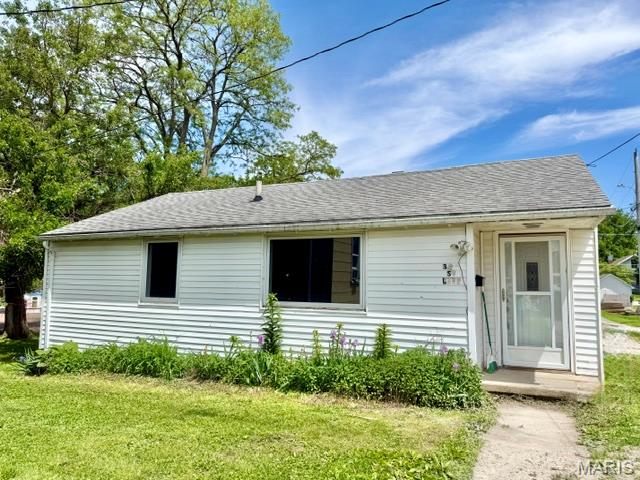 2 bedroom, 1 bath home in Palmyra, MO. Original hardwood floors in the bedrooms, large eat in kitchen (appliances convey), the potential to add back the covered parking (currently used as outdoor living space), shaded backyard and signs of flowers along the home that add to the charm of the property.  Nice starter home or rental.