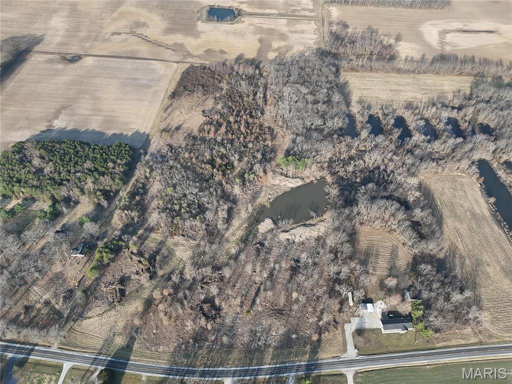 Located in a quiet rural setting, this 6.72-acre tract is a great spot for your future home or investment. With Fountain Water District access at the road, you’ll enjoy convenience while still being surrounded by partially wooded space. Just 11 minutes from Waterloo, IL, this lot is in the Waterloo School District, making it a fantastic location for those seeking both privacy and accessibility.  No pond on this but could be purchased with the property next door that has pond. Property is zoned R2