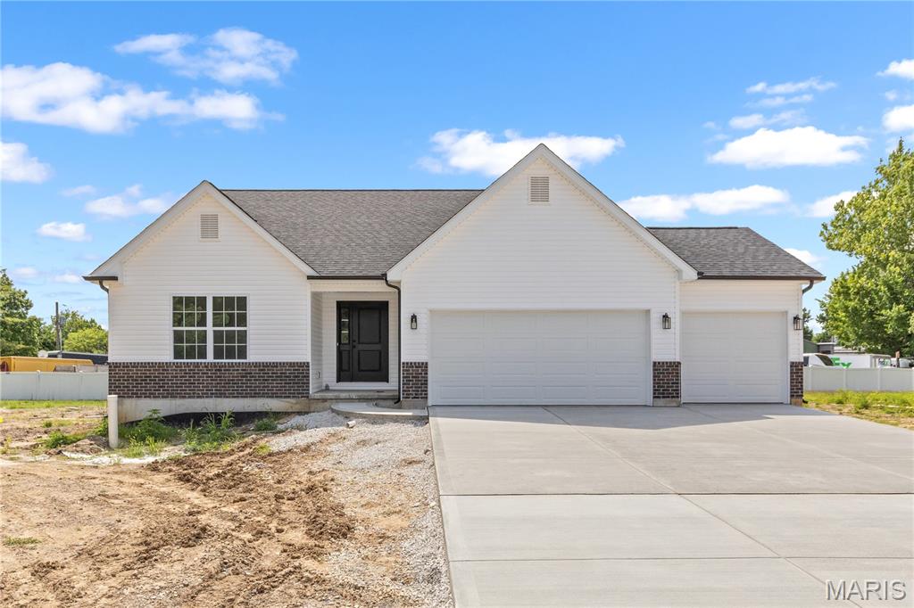 Outstanding opportunity to own a BRAND NEW home in Maryland Heights at an affordable price! This 3 bed, 2 bath is ready for occupancy! Lots of upgrades and premium features throughout! Some brick on front exterior. THREE car garage! LVP flooring running through hall, great room, kitchen, dining, and laundry! Custom kitchen cabinets with quiet close doors and drawers, granite countertops, and stainless appliances! Huge center island with bar stool seating! Separate dining room. Vaulted ceiling in great room for an open feel throughout main living areas. Primary bedroom suite boasting vaulted ceiling, large walk in closet, and private full bath with double bowl vanity. Unfinished rec room with rough in bath and egress window. Just minutes from shopping, dining, schools, and easy access to highway 270 and 367!