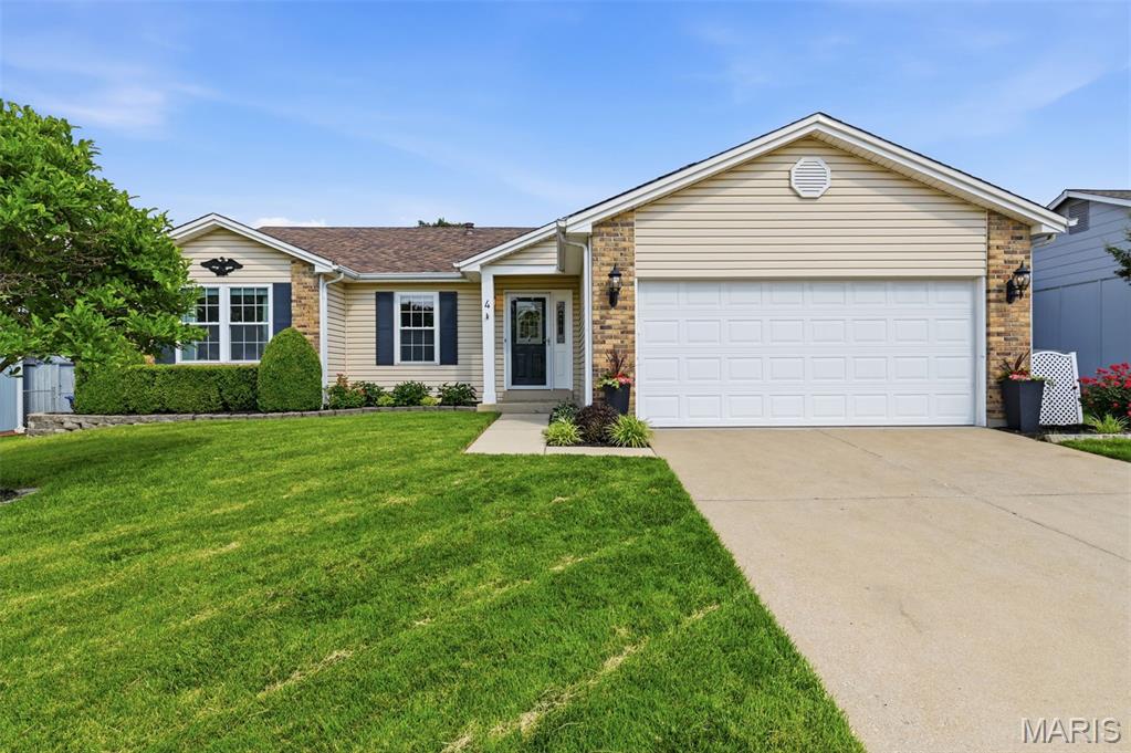 Welcome to this beautifully updated, move-in ready ranch home nestled on a quiet cul-de-sac! This stylish home offers an open and inviting floor plan featuring a vaulted great room with a stunning tile-surround fireplace and hardwood flooring throughout the main level. The fully remodeled kitchen showcases 42” custom cabinetry, low-maintenance quartz countertops, gorgeous tile backsplash, stainless steel appliances, upgraded fixtures, breakfast bar seating, and a charming dining room accented with millwork details. From the dining room step outside to the vaulted covered deck complete with two ceiling fans, creating the perfect outdoor entertaining space overlooking the level backyard, ideal for relaxing evenings or hosting guests. A convenient main-level mud room/laundry room combination adds everyday functionality. The main level includes three spacious bedrooms, including a private primary suite featuring elegant double-door entry, walk-in closet, and a beautifully updated ensuite bath with a large walk-in shower. The hall bathroom has also been beautifully updated. The finished walkout lower level adds exceptional living space with a spacious recreation room, additional bedroom featuring a window, full bath, private office, bonus closets, and abundant storage. Walk directly outside to the peaceful patio area, perfect for relaxing and enjoying the fully fenced backyard. The partially framed basement offers even more potential for future finishing or keep as extra storage. Additional highlights include updated lighting and ceiling fans throughout, newer windows and doors, vinyl siding, low-maintenance landscaping, oversized garage with extra storage space, and plentiful closets throughout the home.  Conveniently located with quick access to major highways, shopping, dining, and more.