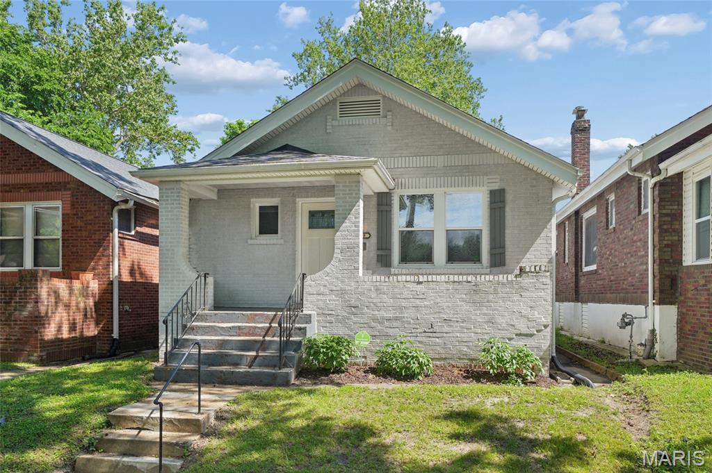 Discover a timeless single-family residence at 6919 Corbitt AVE, STLS MO 63130, a distinguished property built in 1928 that offers a unique blend of historical charm and contemporary living. This home provides an opportunity to own a piece of STLS history, thoughtfully updated for today's discerning homeowner. Covered front porch great for relaxing on a beautiful day. Home has 2 beds, 1 bath with spacious living room and fireplace. Updated lighting throughout, archways, and crown molding. Separate dining with natural light, eat in kitchen with appliances. Backyard has privacy with double parkin pad. This exceptional property invites you to experience refined living; schedule your private viewing today.
