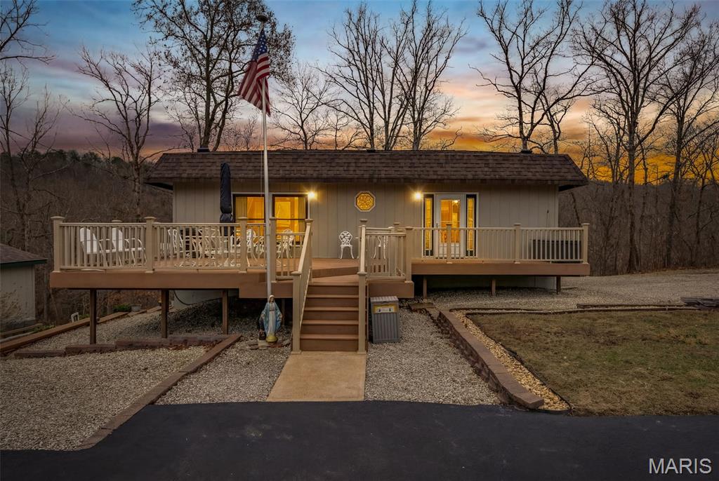 Welcome home to this beautifully maintained two-level home in a gated lake community offering a host of impressive features. Enjoy a spacious composite front deck that creates a warm welcome, and a generous rear deck perfect for relaxing or entertaining. The main level boasts a large 20x19 living room addition, providing ample space for gatherings. The lower-level features 2 bedrooms and a family room with a pine ceiling that adds a charming rustic, cozy ambiance. The lower-level family room could also be used as an additional sleeping area. Situated on four lots, the property has also includes an adorable 26x14 barn-style garage with a loft. Additional highlights include an asphalt driveway, two separate staircases leading to the lower level, and so much more to discover. Roof and gutters are brand new!
Located within an hour of St. Louis or Cape Girardeau, Grayhawk is the perfect retreat with nearly 1000 acres, including nearly 200 acres of stocked lakes. Whether it's fishing, boating, hiking or relaxing by a cozy campfire, our community has much to offer and is near historic Ste. Genevieve and the heart of wine country!