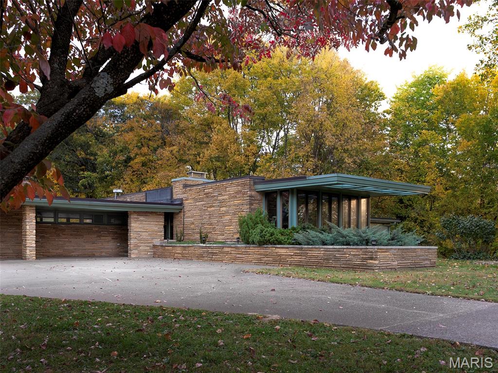 1952 mid-century prairie-style ranch by John Boardman on 3+ private acres.
For your consideration, this architecturally significant, 1952 mid-century prairie-style ranch by noted
local architect John L.E. Boardman. Set privately among mature trees on over three acres within the
Alma Schrader school district, now available for the first time in many years. Reflecting classic
mid-century principles with original architectural details preserved throughout.
Spanning 4,500+ sq ft, the single-level home includes four bedrooms, three full bathrooms, two
dining areas, two sitting rooms and a wet bar. Stone surfaces extend from exterior to interior, while
terrazzo floors and wood carsiding ceilings run throughout the living areas. Large windows, some
wall-spanning, others clerestory, flood the home with natural light and frame views of the wooded
property. Bringing the outdoors in, the formal dining room features a 19ft long raised indoor garden.
Original built-ins include three built-in sofas, extensive custom cabinetry and storage closets, and a
dedicated wine storage cabinet. Two gas fireplaces anchor the main living spaces, and mini-split
systems provide heating and cooling to primary areas. Restoration efforts have reintroduced
previously concealed windows, preserving the home’s architectural intent while leaving
opportunities for thoughtful continuation.
Outdoors, the property features an original concrete swimming pool, fenced in backyard and an
outbuilding with attached lean-to for mower and equipment storage. Approximately 1/4 mile from
Kiwanis Park, this estate offers rare privacy within city limits.
At the property line is a small historic home on a separate nearly one-acre parcel, available for
purchase separately.