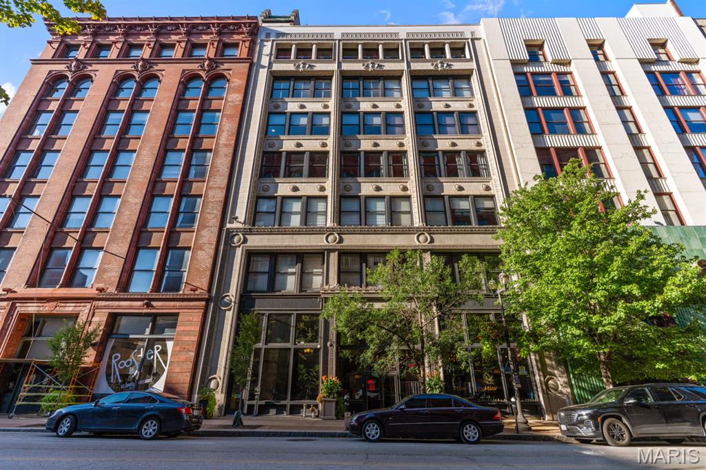 Urban Loft Living at 1015 Washington Ave., Unit 501
2 Bedrooms | 2 Bathrooms | 1,317 Sq. Ft.

Experience the perfect blend of historic charm and contemporary style in this beautifully updated downtown loft, ideally situated at the highly sought after corner of 11th Street and Washington Avenue.

This move in ready residence offers an impressive list of upgrades, including updated lighting, modern kitchen and bathroom finishes, enhanced closet systems, newer appliances, a brand new garbage disposal, and a thoughtfully designed layout that combines comfort with functionality.

Inside, you'll find soaring timber ceilings, exposed brick walls, oversized windows that flood the space with natural light, and an open floor plan that captures the true essence of urban loft living.

The stylish kitchen is designed for both everyday living and entertaining, featuring granite countertops, upgraded cabinetry, a bar height island, a built in drawer microwave with push button open and close, black stainless steel appliances, and a brand new garbage disposal. An in unit washer and electric dryer add everyday convenience.

The spacious primary suite offers a walk in closet and a beautifully updated ensuite bathroom with a double sink vanity, deep soaking tub, separate shower, and a newly installed toilet with decorative shelving above.

Both bedrooms feature modern barn doors that enhance the loft's industrial character while maximizing usable space. Ceiling fans throughout provide added comfort year round.

Building Amenities Include:
• Secure climate controlled garage with one assigned parking space
• Private storage locker on the second floor
• Rooftop patio with breathtaking downtown skyline views
• Fitness center
• Secure building access

Located just steps from Ballpark Village, Busch Stadium, CityPark, award winning restaurants, entertainment, shopping, and MetroLink, this exceptional loft offers the best of downtown St. Louis living.

Historic character. Modern updates. Prime location. Welcome home to 1015 Washington Avenue, Unit 501.