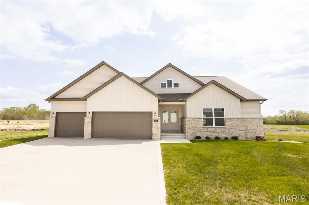 Luxury abounds in this stunning BRAND NEW Home!  Builder Spencer Homes is known for luxury finishes, attention to detail, and superior materials and this home reflects all. Upon entering through the gorgeous double doors, you'll fall in love with the floorplan. The split bedroom concept offers 2 bedrooms with a Jack n Jill bathroom and spacious primary suite with tray ceiling. The primary bath is a SHOWSTOPPER featuring a wet room with gorgeous custom tile, free standing tub, and double shower heads. The living room offers an abundance of natural light, tray ceiling, fireplace, and opens to the beautiful custom kitchen. Entertaining will be a breeze! The kitchen features include hand selected, designer style fixtures, Amish made cabinets, sleek quartz counter tops, island, and pantry with solid shelving. The finished daylight basement brings even more additional space to spread out featuring 4th bedroom, full bathroom, large living room, and bonus room (office or workout space - your choice!)  All this AND an abundance of storage space too! Out back, you'll enjoy the spacious, composite, covered deck and fully sodded yard. No detail has been left unnoticed - additional features include 3 car garage, Quartz countertops in kitchen AND bathrooms, Trane HVAC, 2x6 exterior wall framing with R19 insulation and ceilings@R-49.  If high end, luxury living is your desire, this home is all that and more.