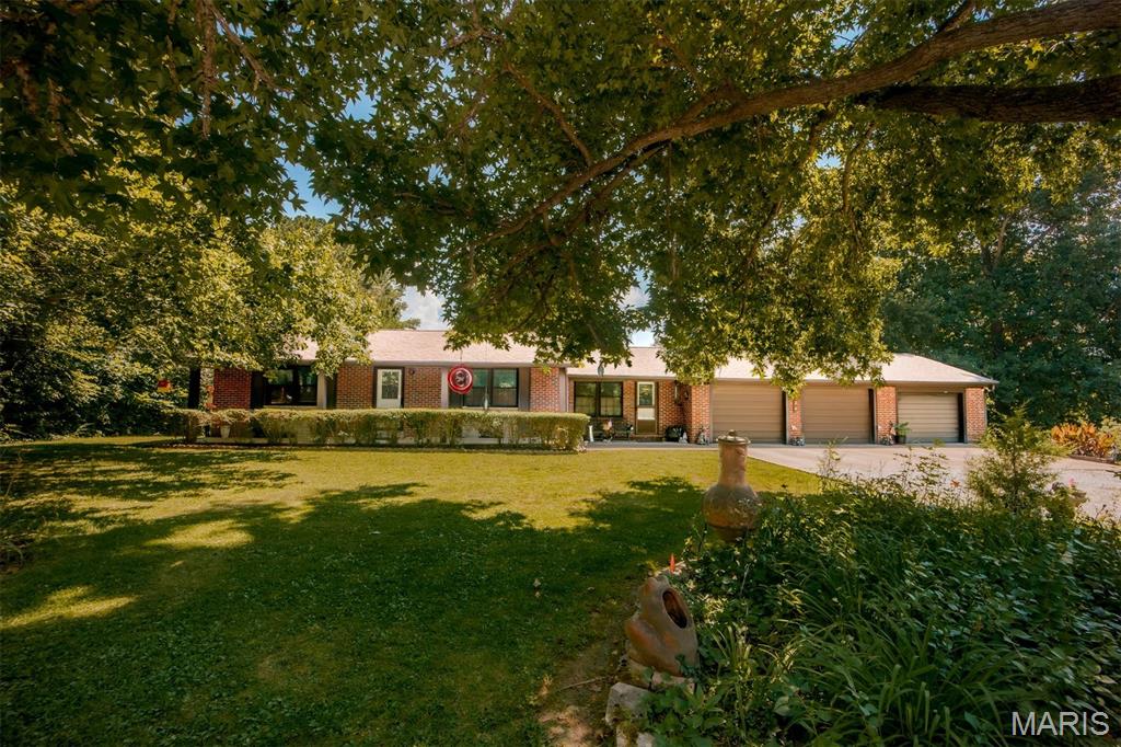 A rare opportunity awaits in the heart of Wildwood! Nestled on 3.127 picturesque acres, this property offers a beautiful park-like setting with endless possibilities. Whether you're looking for a move-in ready home to make your own or envision building your dream home on this incredible piece of land, this property provides the flexibility to fit your plans.
The current home features a spacious one-bedroom layout, with the potential to easily convert it back into a two-bedroom by replacing the previously removed wall. The updated kitchen offers modern cabinetry, granite countertops, and updated appliances, while the remodeled bathroom features a stylish walk-in shower. A newer roof, approximately 1.5 years old, provides added peace of mind.
You'll appreciate the convenience of the breezeway connecting the home to the oversized three-car garage, with the laundry area conveniently located within the breezeway. Step outside to the expansive 26' x 40' patio, perfect for entertaining, relaxing, or enjoying the peaceful surroundings.
With mature trees, open green space, and a prime Wildwood location, this unique property is ideal for those seeking privacy, room to roam, or the opportunity to create something truly special. Don't miss your chance to own this one-of-a-kind property with unlimited potential!