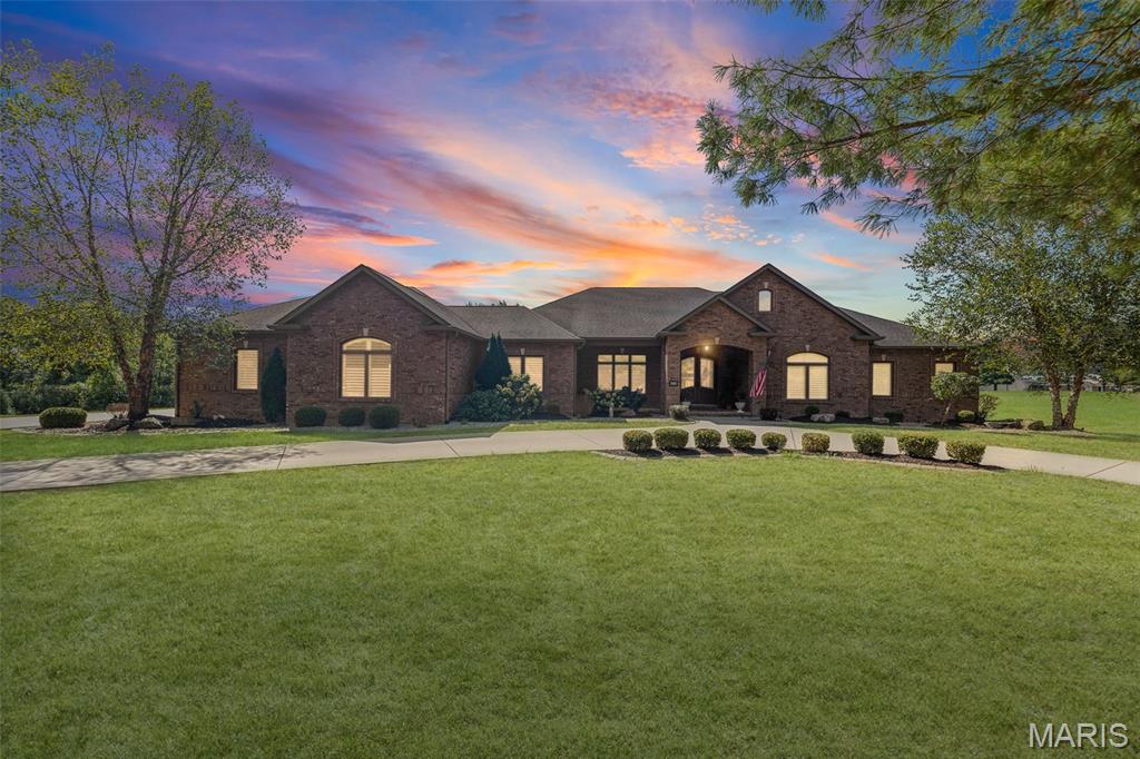 STUNNING GODFREY HOME ! THIS LUXURIOUS CUSTOM BUILT 4 BEDROOM, 5 BATH HOME WILL BE SURE TO IMPRESS. UPGRADES ABOUND THROUGHOUT. FEATURES GREAT ROOM WITH VAULTED CEILINGS AND DINING AREA WITH TRAY CEILING , KITCHEN WITH CUSTOM CABINETS,  LARGE CENTER ISLAND, GRANITE COUNTERTOPS, HIGH END STAINLESS STEEL APPLIANCES, WALK IN PANTRY, AND BUTLERS PANTRY. BREAKFAST AREA WITH DEN . LARGE PRIMARY BEDROOM FEATURES 16X8 DRESSING ROOM, SAFE ROOM. PRIMARY  BATH HAS OVERSIZED ZERO EGRESS WALK IN SHOWER, DUAL VANITY, ACCESIBLE BATH, AND SEPERATE POWDER ROOM. SECOND MAIN LEVEL  BEDROOM HAS ENSUITE BATH. LOWER LEVEL HAS BEDROOM AND BATH. REMAINDER OF WALKOUT LOWER LEVEL IS FRAMED OUT AND JUST NEEDS YOUR FINISHING TOUCHES. ZONED HEATING AND COOLING, WHOLE HOUSE GENERATOR,  AND TANKLESS WATER HEATER. LARGE MAIN LEVEL  LAUNDRY ROOM. OVERSIZED SIDE ENTRY 3 CAR GARAGE. COVERED DECK OFF DEN WITH BUILT IN GAS GRILL. PROPERTY CONSIST OF 7.15 ACRE LOT SITE. THIS EXTREMELY TASTEFUL HOME  IS AVAILABLE FOR YOUR PRIVATE SHOWING.