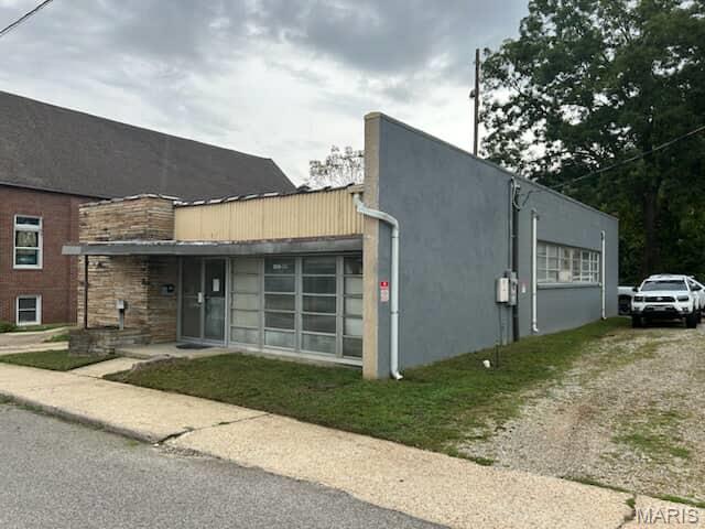 Located right on the square in the heart of historic downtown Waynesville, this versatile commercial building offers endless potential for your business. Currently set up as a woodworking shop, the property features:

Front lobby with storefront visibility
Office space for administrative needs
Bathroom for staff and clients
Two large bay doors for easy access and deliveries
High ceilings & open warehouse-style layout perfect for light industrial, storage, or creative studio use

The charm of downtown combined with the customizable space of a warehouse makes this property a rare find. Whether you’re continuing as a workshop, opening a retail space, or establishing your business headquarters, this building offers the flexibility and location you need.
Historic Downtown Waynesville – right on the square, surrounded by shops, dining, and local attractions.