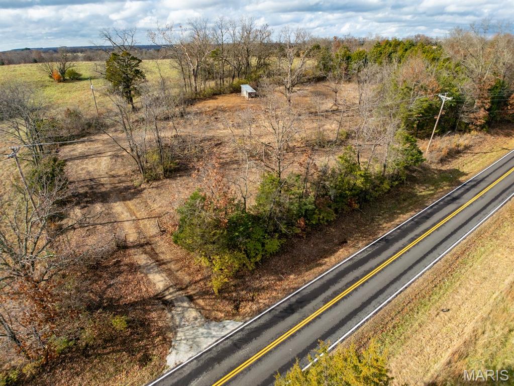 NEARLY 2 ACRES WITH WELL & SEPTIC just 1 mile from Rolla City Limits on PAVED State Highway!  This property is ready for your new build, modular, or manufactured home.  Very private with a tree lined boundary and surrounded by larger farms, this property could be your oasis away, but just minutes to shopping, restaurants, and activities!