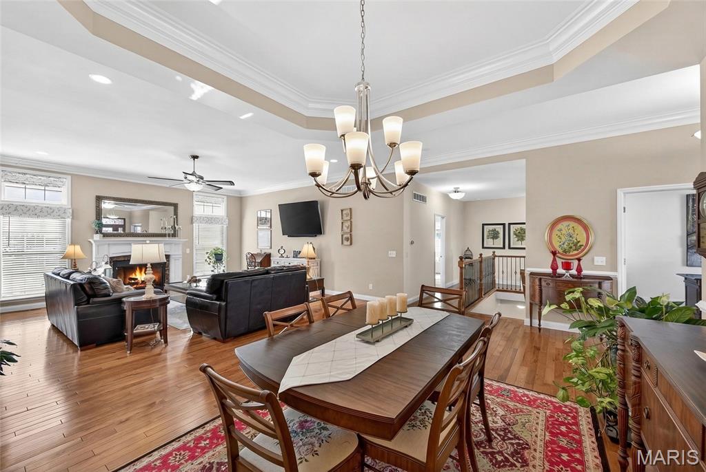 *Open House Sunday 1-3PM*   This is the one!!  Elegant home built by Executive Homes. Step into this stunning home showcasing 10 ft ceilings, rich hardwood floors and abundant natural lighting. A chef inspired kitchen with a large walk-in pantry. Expansive Primary Suite includes double vanity, and a super-sized walk-in closet. With 3,643 square foot of living space, 2350 main level and 1293 lower level this home was thoughtfully designed with ample room to live, work and entertain.
Outdoor living is another highlight of this home with wonderful space on both levels. The main level features a covered deck, while the walk-out lower level includes a newly installed dry roofing system beneath the upper deck, creating additional protected outdoor space below
The finished walk-out basement includes a wet bar, billiard area, and recreational space-perfect for entertaining. 4th bedroom and full bath, great to accommodate overnight guest. There is also plenty of storage space available.
Additional features include a spacious 3 car garage, main-floor laundry and a lawn sprinkler system.